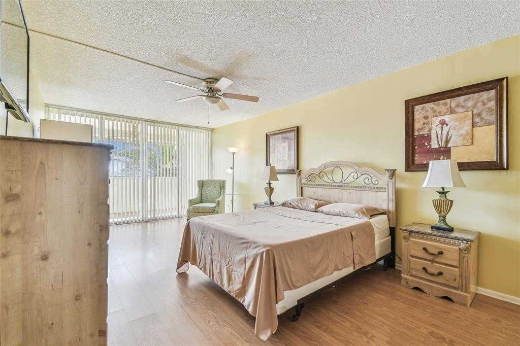 17920 Gulf Boulevard, Unit 208 Redington Shores, FL 33708 - Photo 21 of 98 a bedroom with a bed and dresser