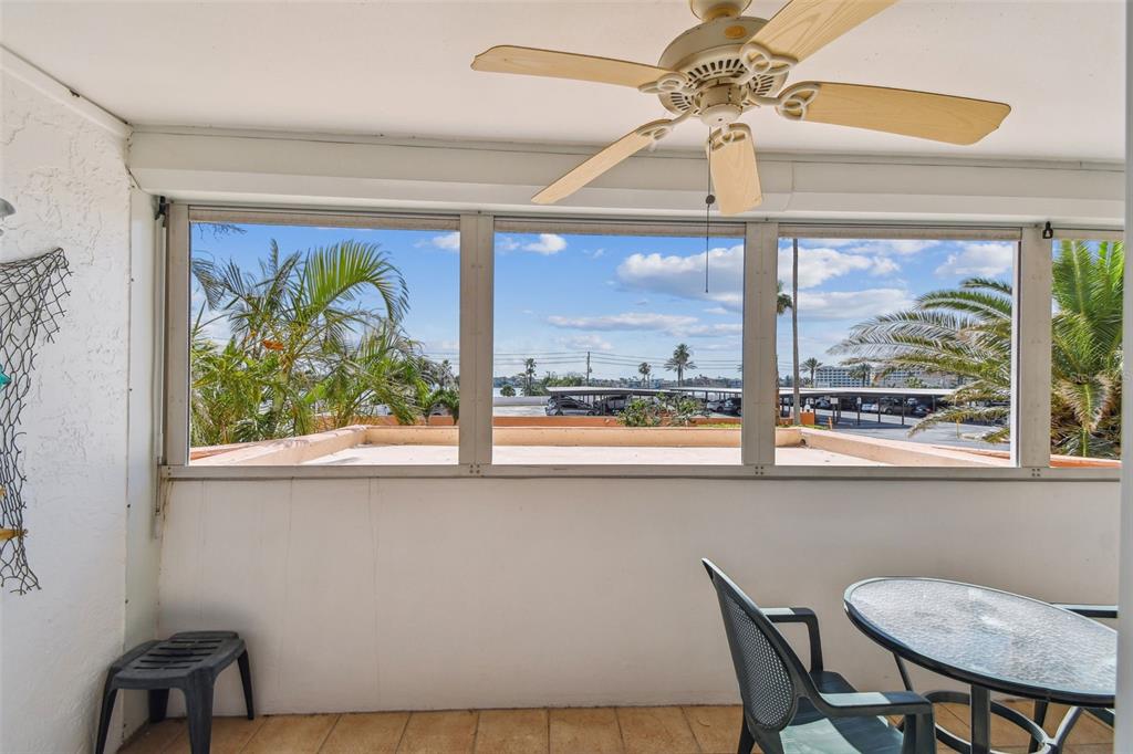 17920 Gulf Boulevard, Unit 208 Redington Shores, FL 33708 - Photo 38 of 98 a view of a dining room with furniture a chandelier and a window