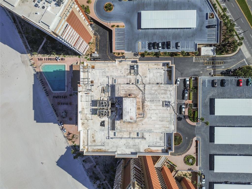 17920 Gulf Boulevard, Unit 208 Redington Shores, FL 33708 - Photo 53 of 98 a kitchen with stainless steel appliances kitchen island granite countertop a stove and a sink