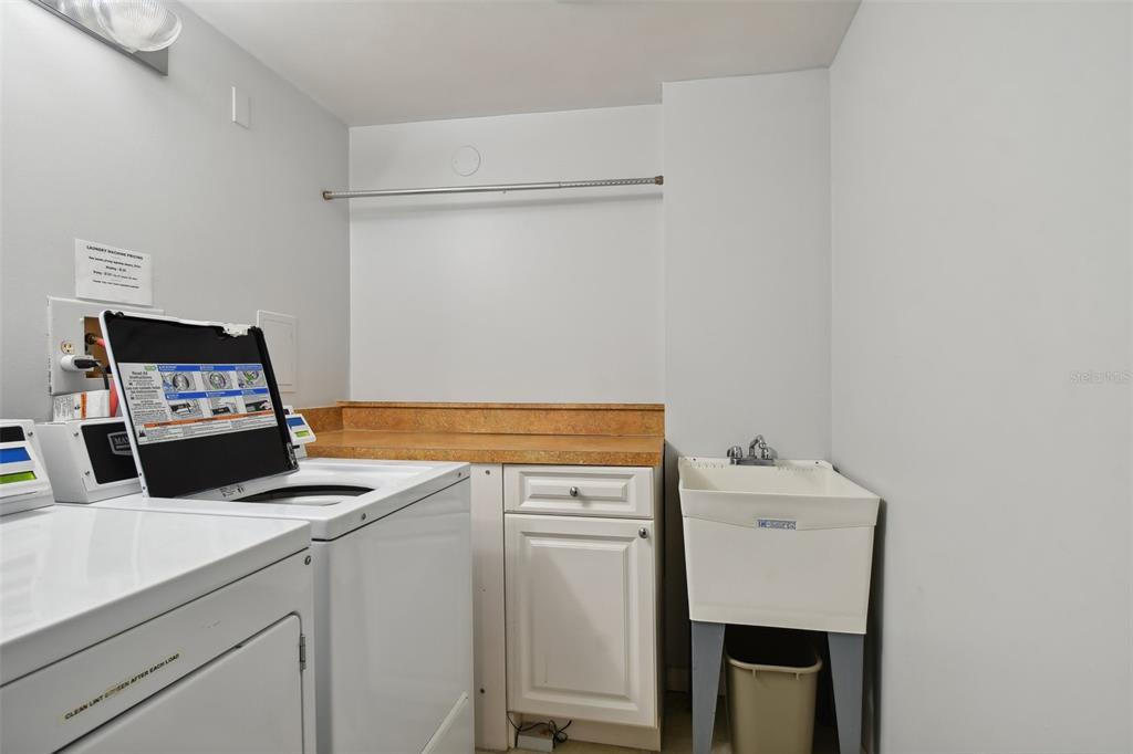 17920 Gulf Boulevard, Unit 208 Redington Shores, FL 33708 - Photo 75 of 98 a view of a storage and utility room with washer and dryer