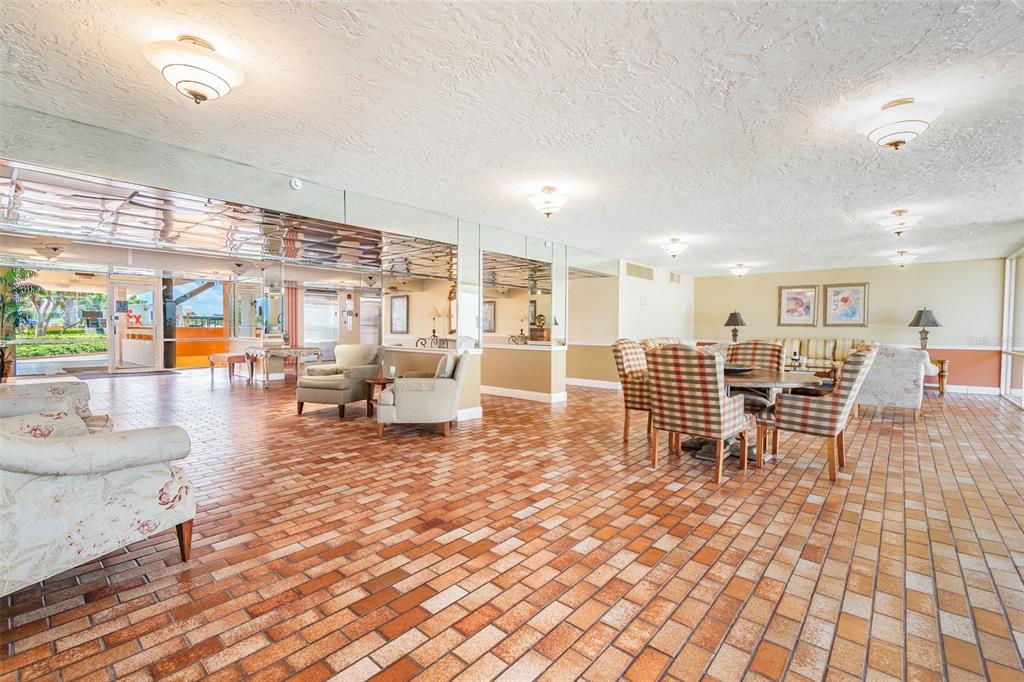 17920 Gulf Boulevard, Unit 208 Redington Shores, FL 33708 - Photo 80 of 98 a living room with furniture a wooden floor and next to a window