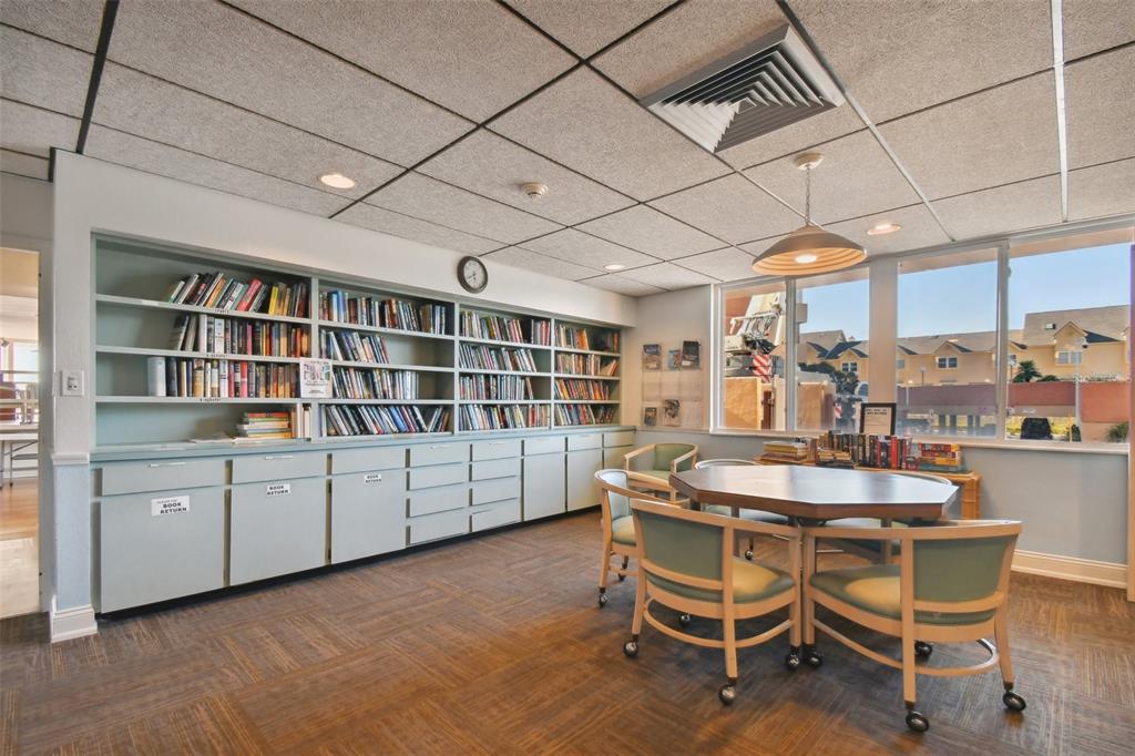 17920 Gulf Boulevard, Unit 208 Redington Shores, FL 33708 - Photo 83 of 98 a dining room with furniture and a book shelf