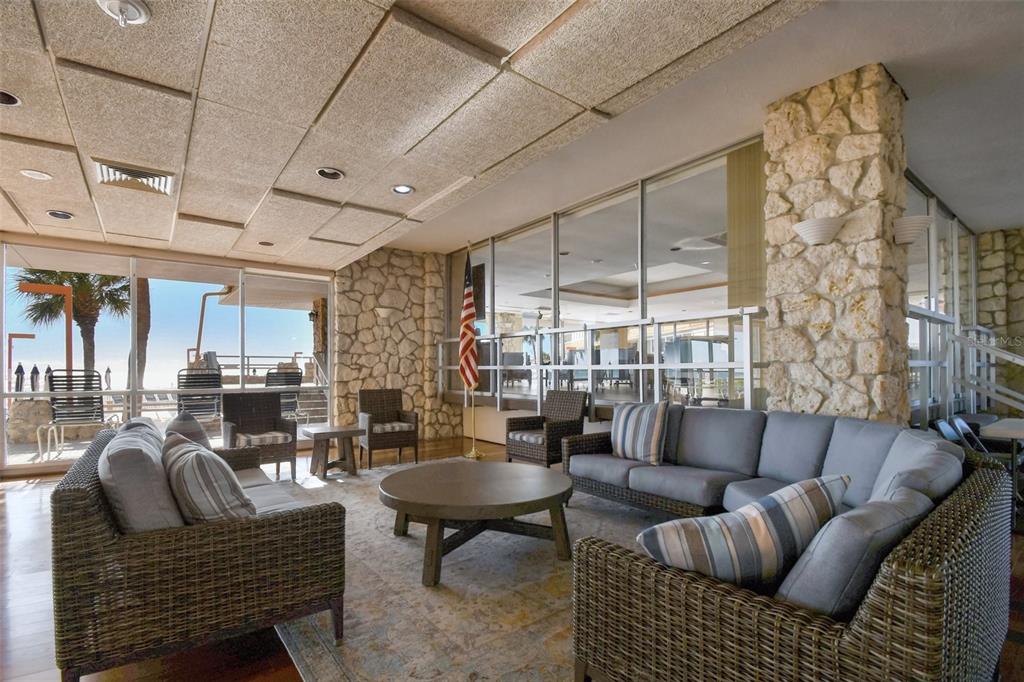 17920 Gulf Boulevard, Unit 208 Redington Shores, FL 33708 - Photo 94 of 98 a living room with furniture a fireplace and a table