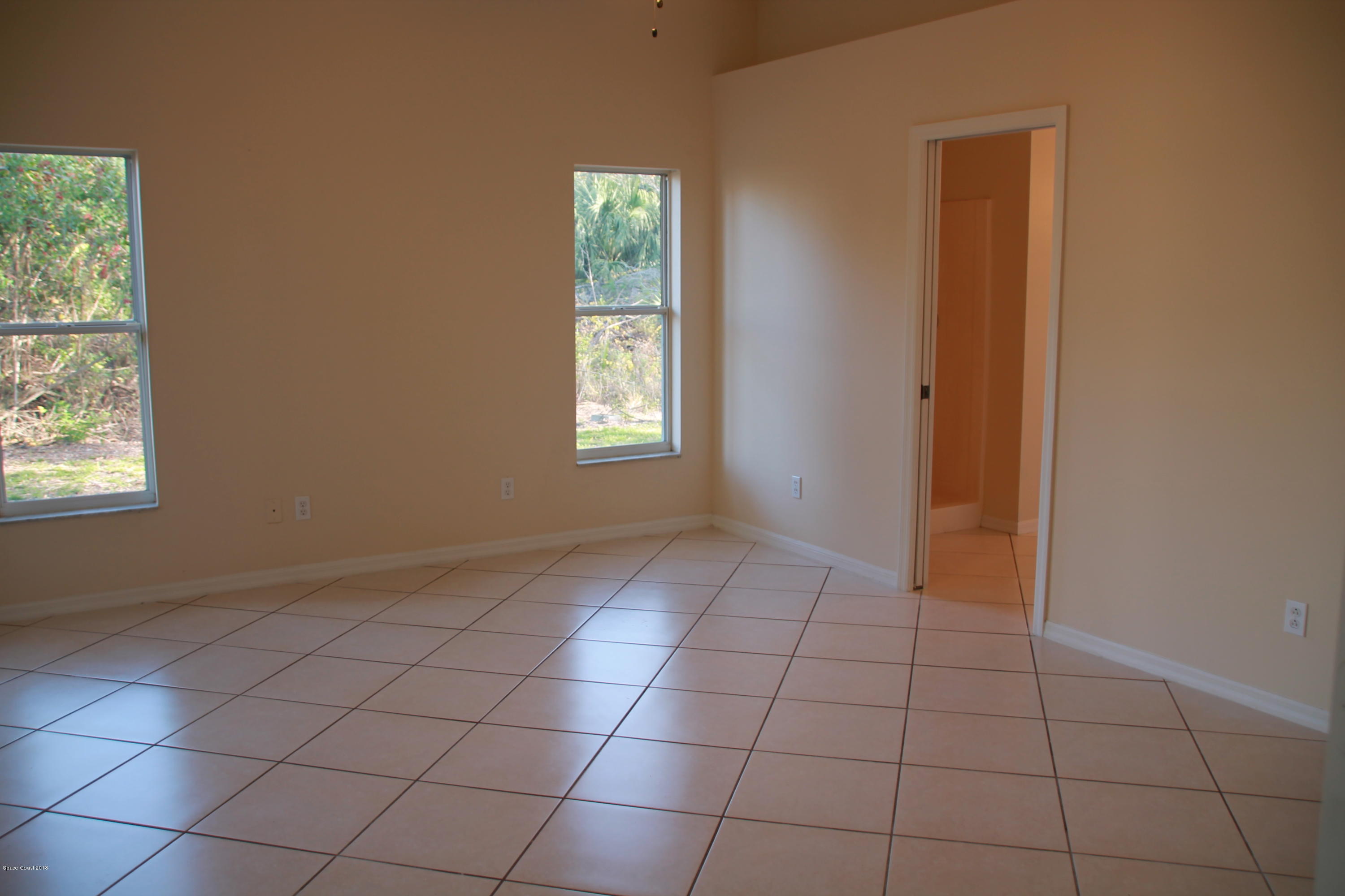 771 Titan Road Southeast Palm Bay, FL 32909 - Photo 11 of 19 Master Bedroom