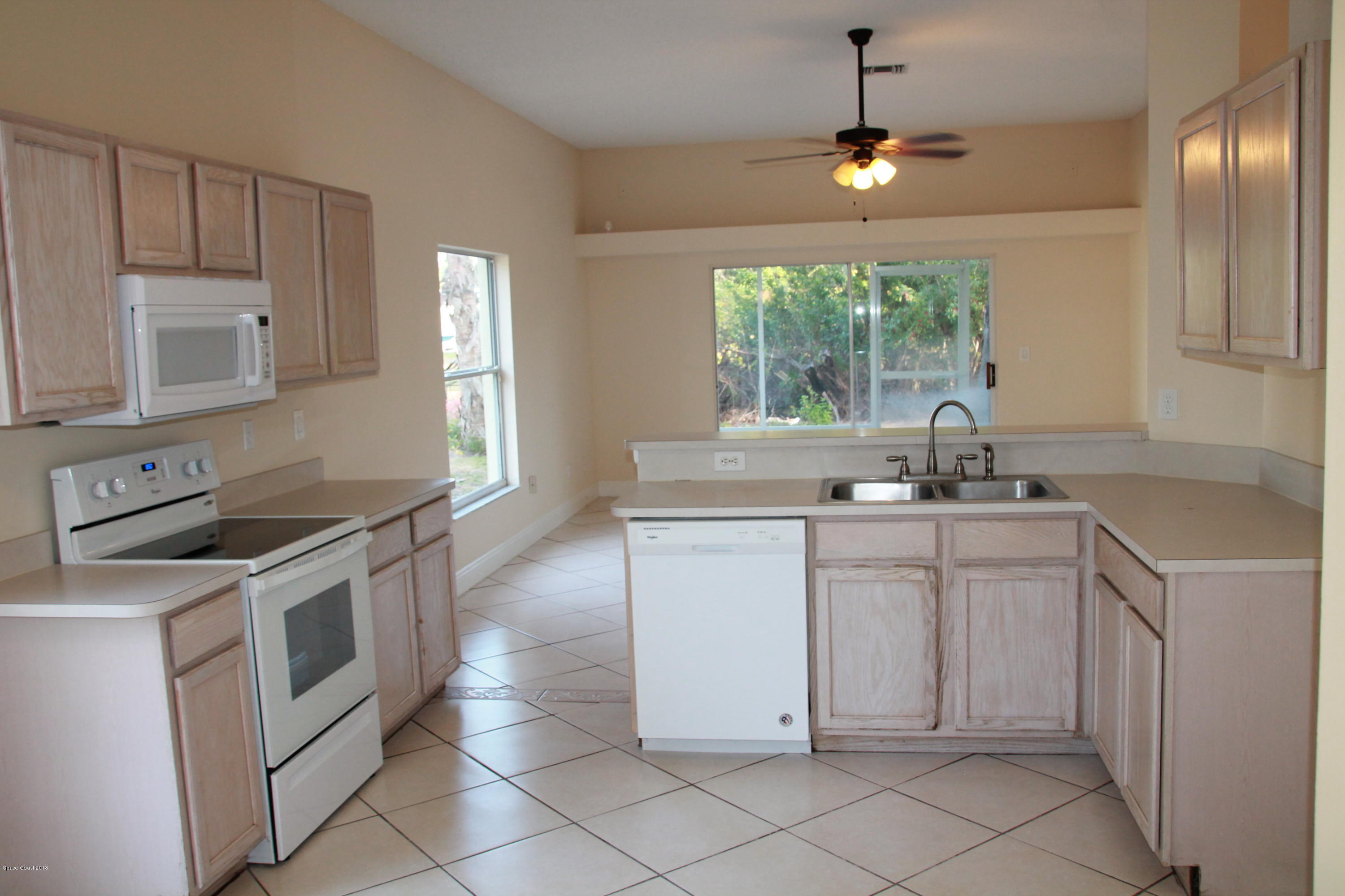 771 Titan Road Southeast Palm Bay, FL 32909 - Photo 9 of 19 Kitchen View 2