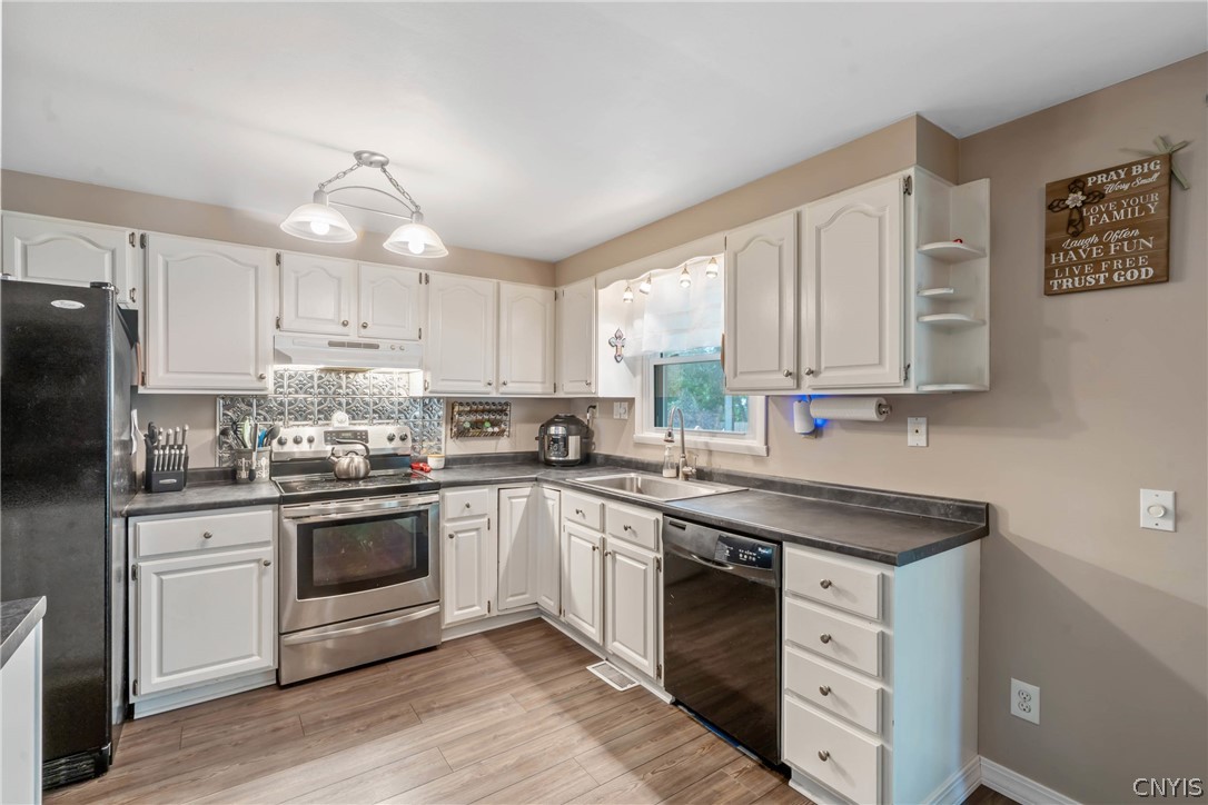 4346 Old Meadow Road Clay, NY 13041 - Photo 11 of 33 Set beside the dining room, we find the kitchen wi