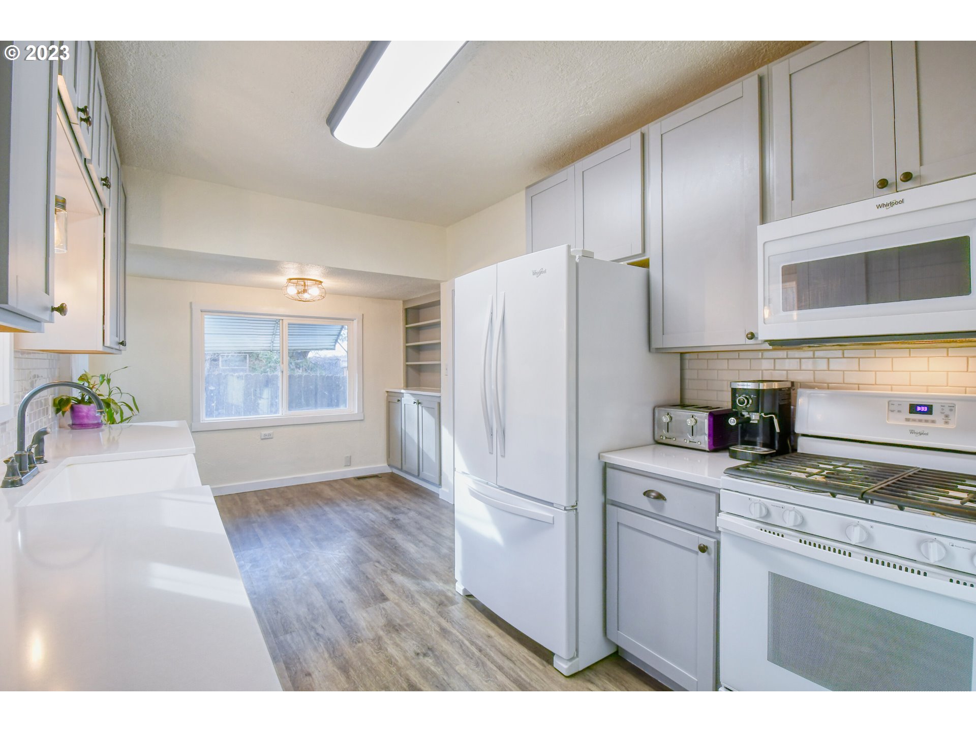 2002 Southeast Court Avenue Pendleton, OR 97801 - Photo 11 of 32 a kitchen with stainless steel appliances a refrigerator sink and cabinets