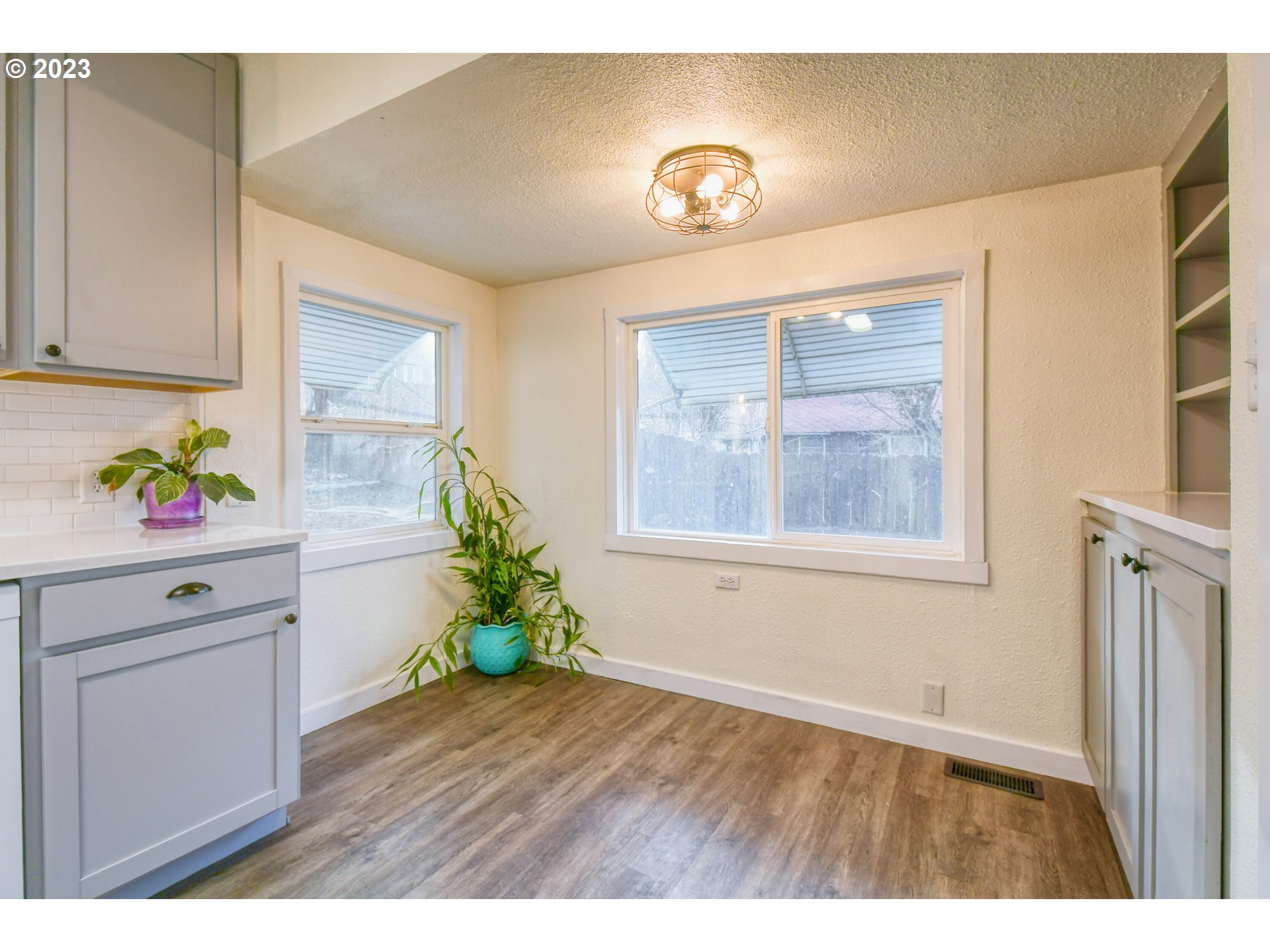2002 Southeast Court Avenue Pendleton, OR 97801 - Photo 15 of 32 a room with wooden floor and a potted plant