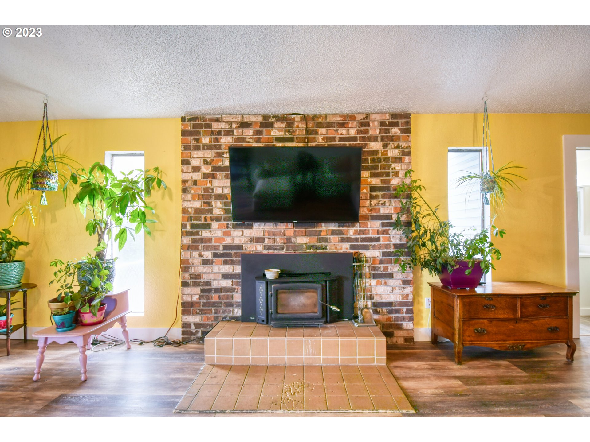 2002 Southeast Court Avenue Pendleton, OR 97801 - Photo 7 of 32 a living room with a flat screen tv and a fireplace