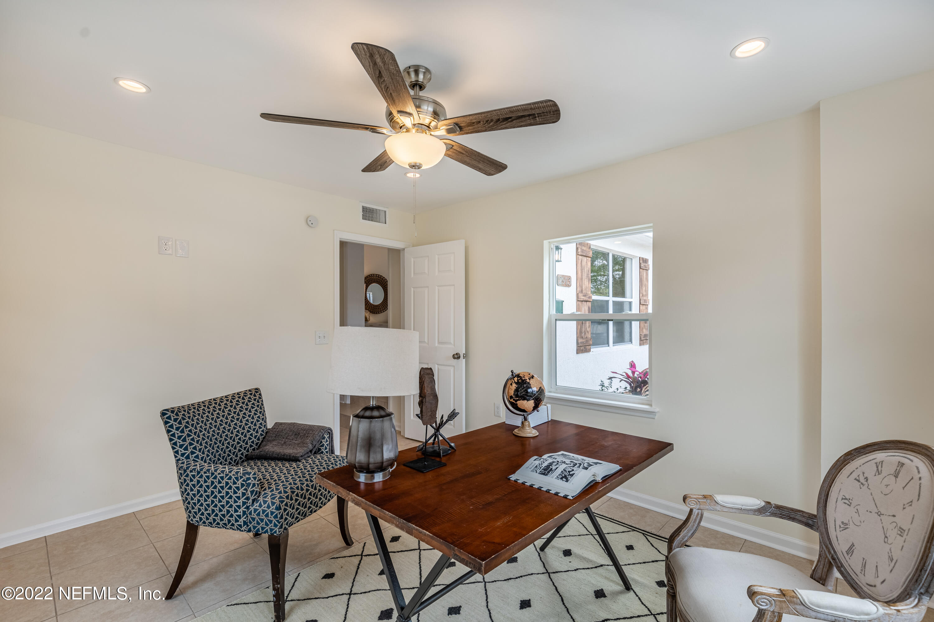 2913 Mansion Road Jacksonville, FL 32277 - Photo 14 of 30 a living room with furniture and a window