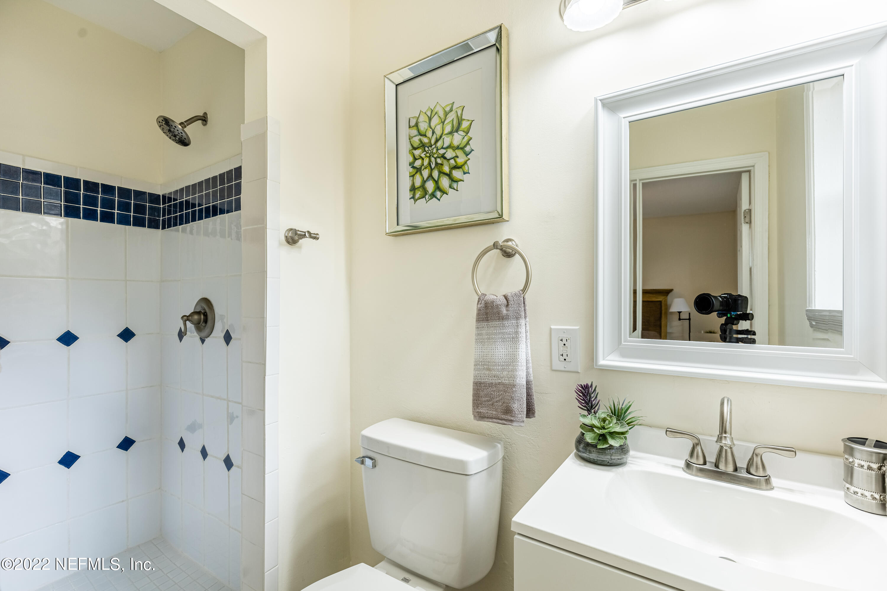 2913 Mansion Road Jacksonville, FL 32277 - Photo 18 of 30 a bathroom with a sink a toilet and shower