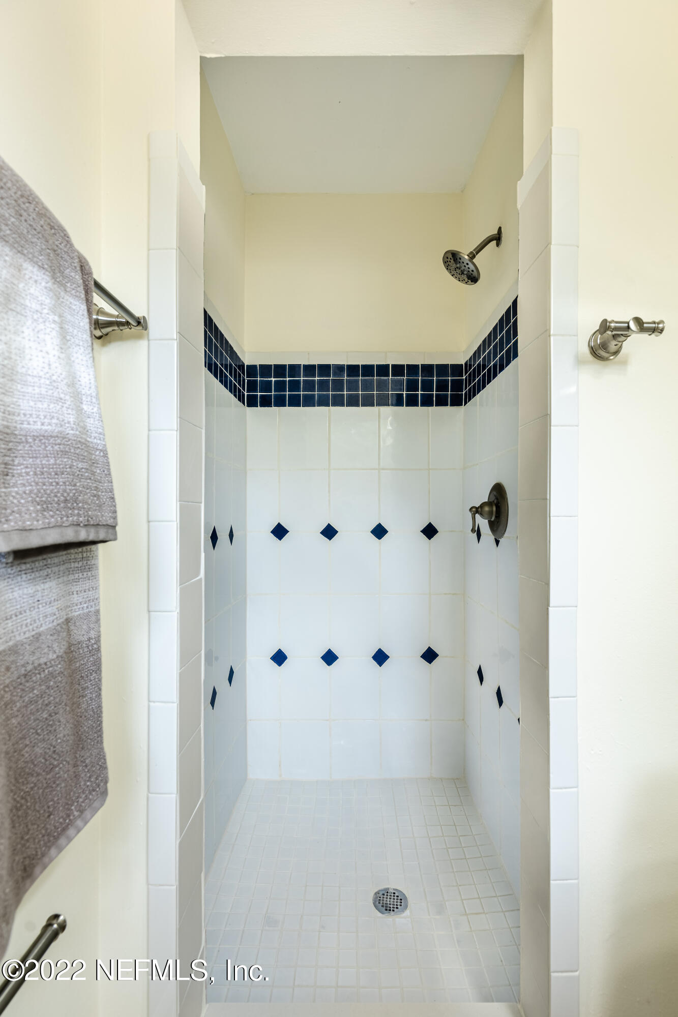2913 Mansion Road Jacksonville, FL 32277 - Photo 19 of 30 a bathroom with a glass shower door