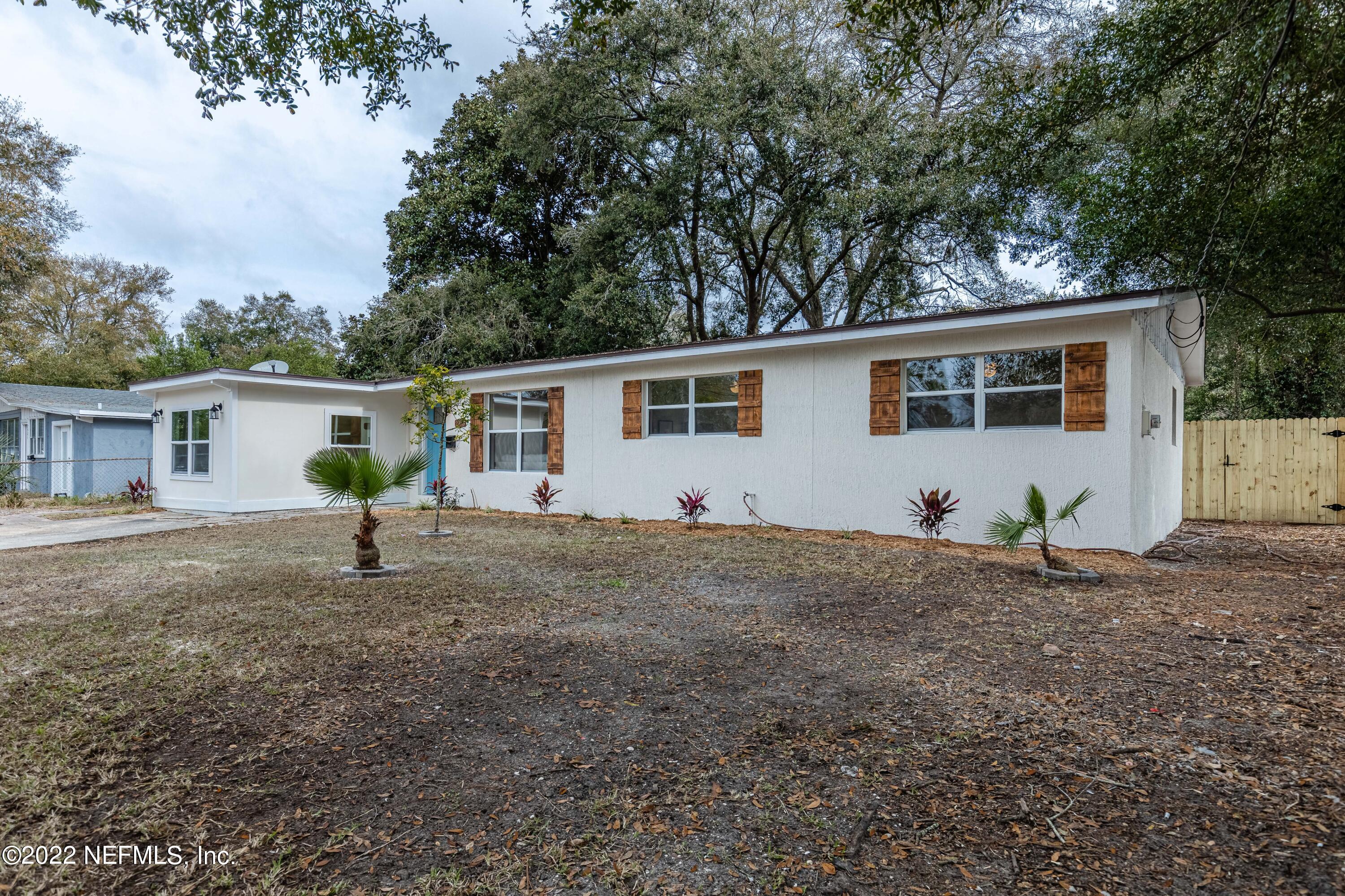 2913 Mansion Road Jacksonville, FL 32277 - Photo 2 of 30 a house with trees in the background
