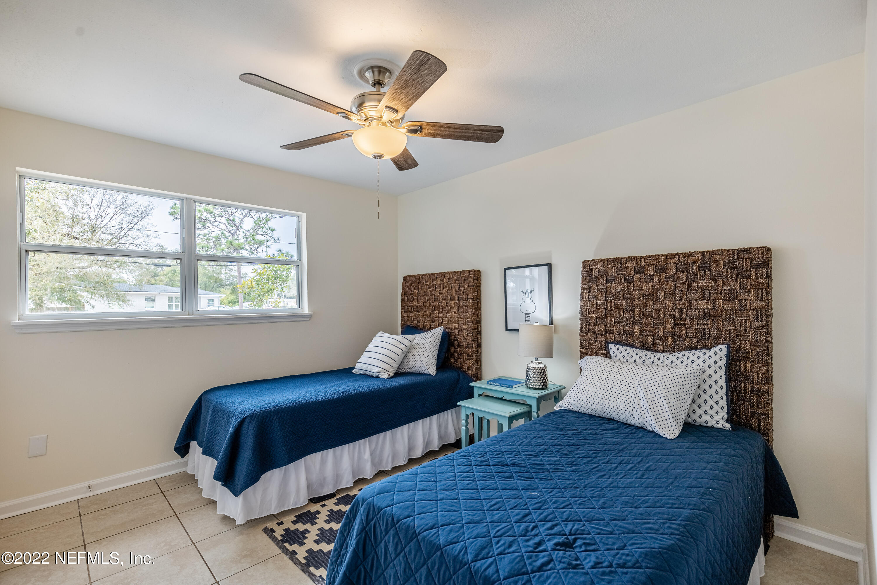 2913 Mansion Road Jacksonville, FL 32277 - Photo 22 of 30 a bedroom with two beds and a window