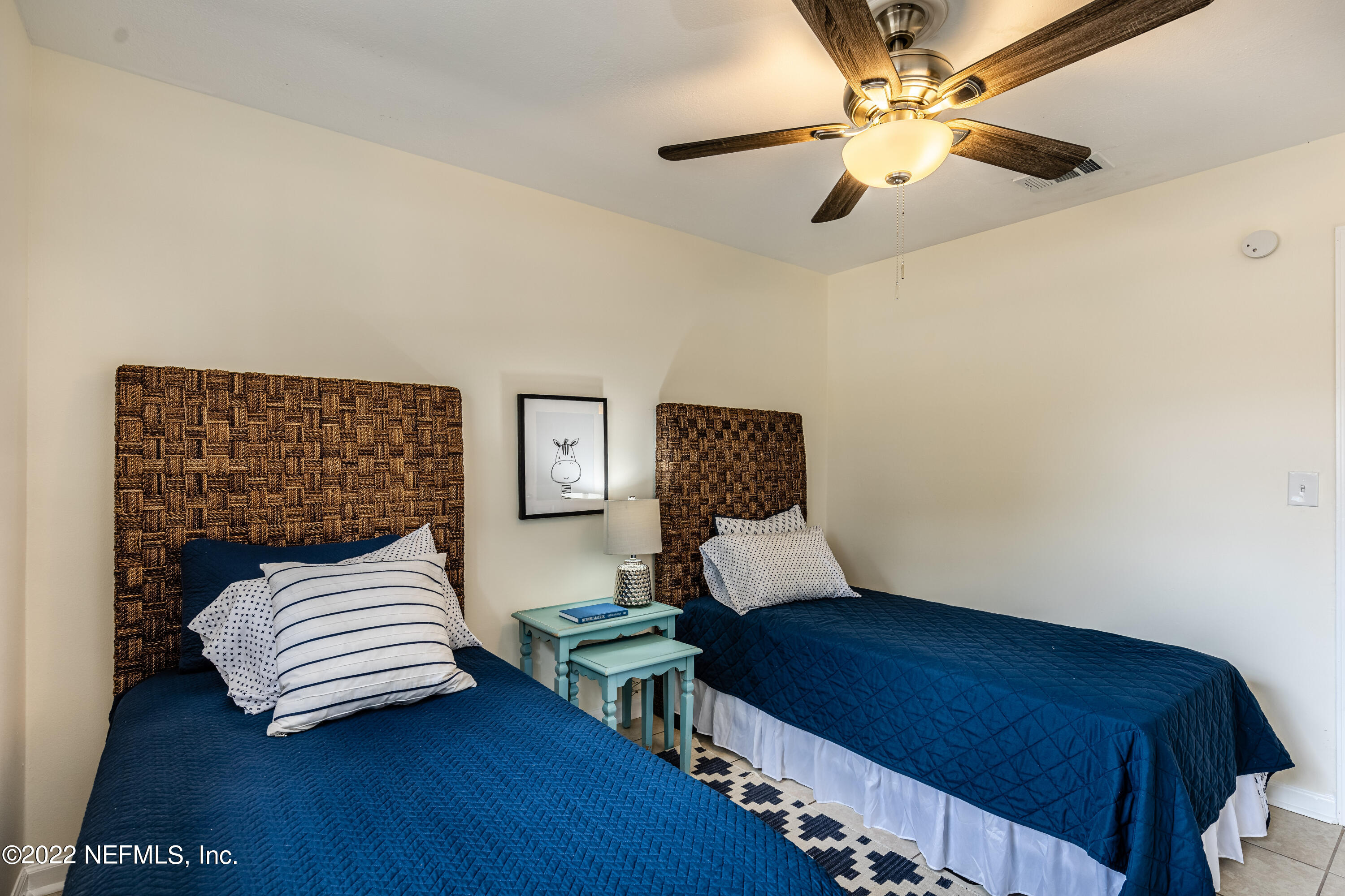 2913 Mansion Road Jacksonville, FL 32277 - Photo 23 of 30 a bedroom with a bed and wooden floor