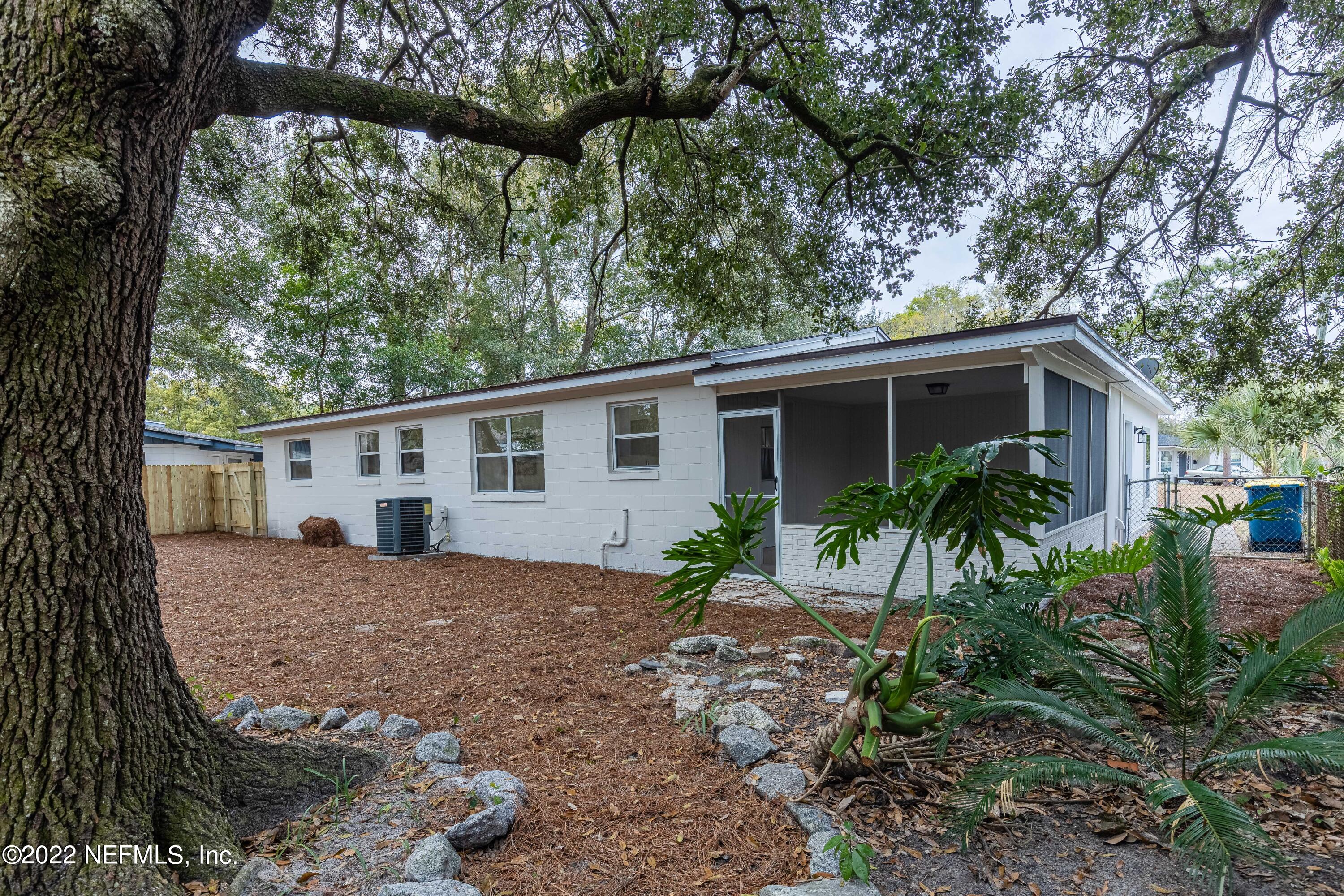 2913 Mansion Road Jacksonville, FL 32277 - Photo 28 of 30 a view of a house with a yard