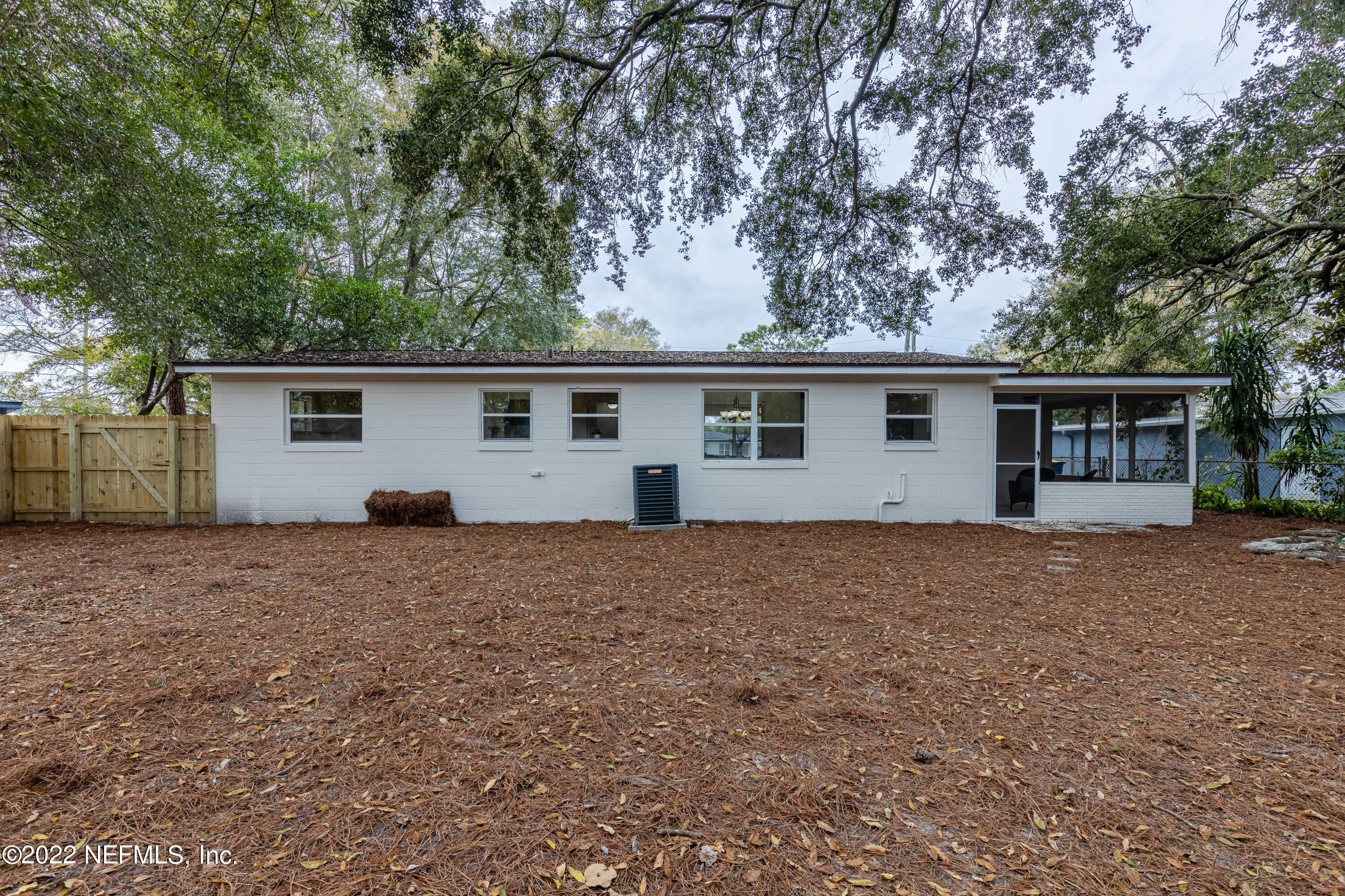 2913 Mansion Road Jacksonville, FL 32277 - Photo 29 of 30 a house with trees in the background