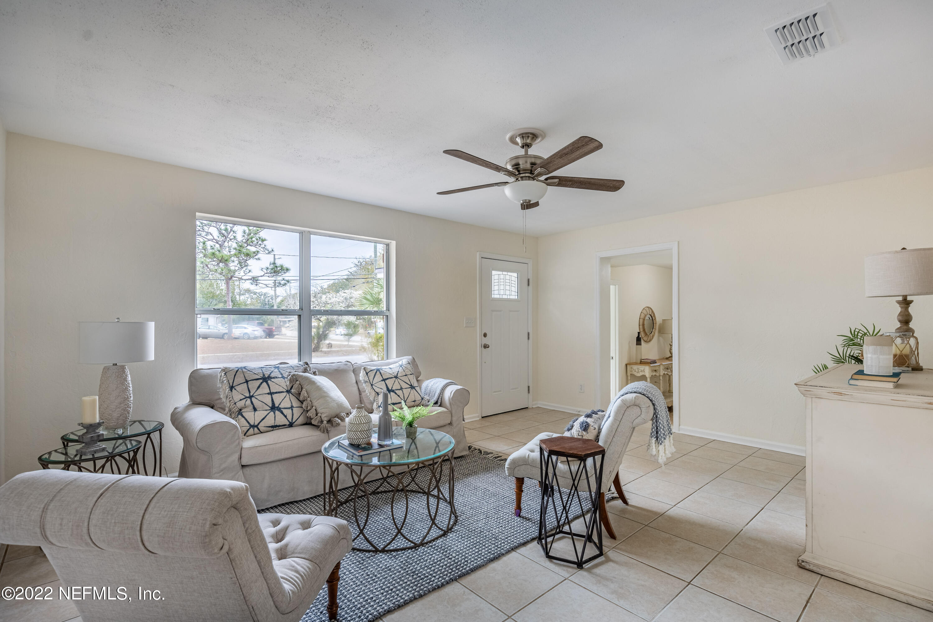 2913 Mansion Road Jacksonville, FL 32277 - Photo 6 of 30 a living room with furniture and a large window