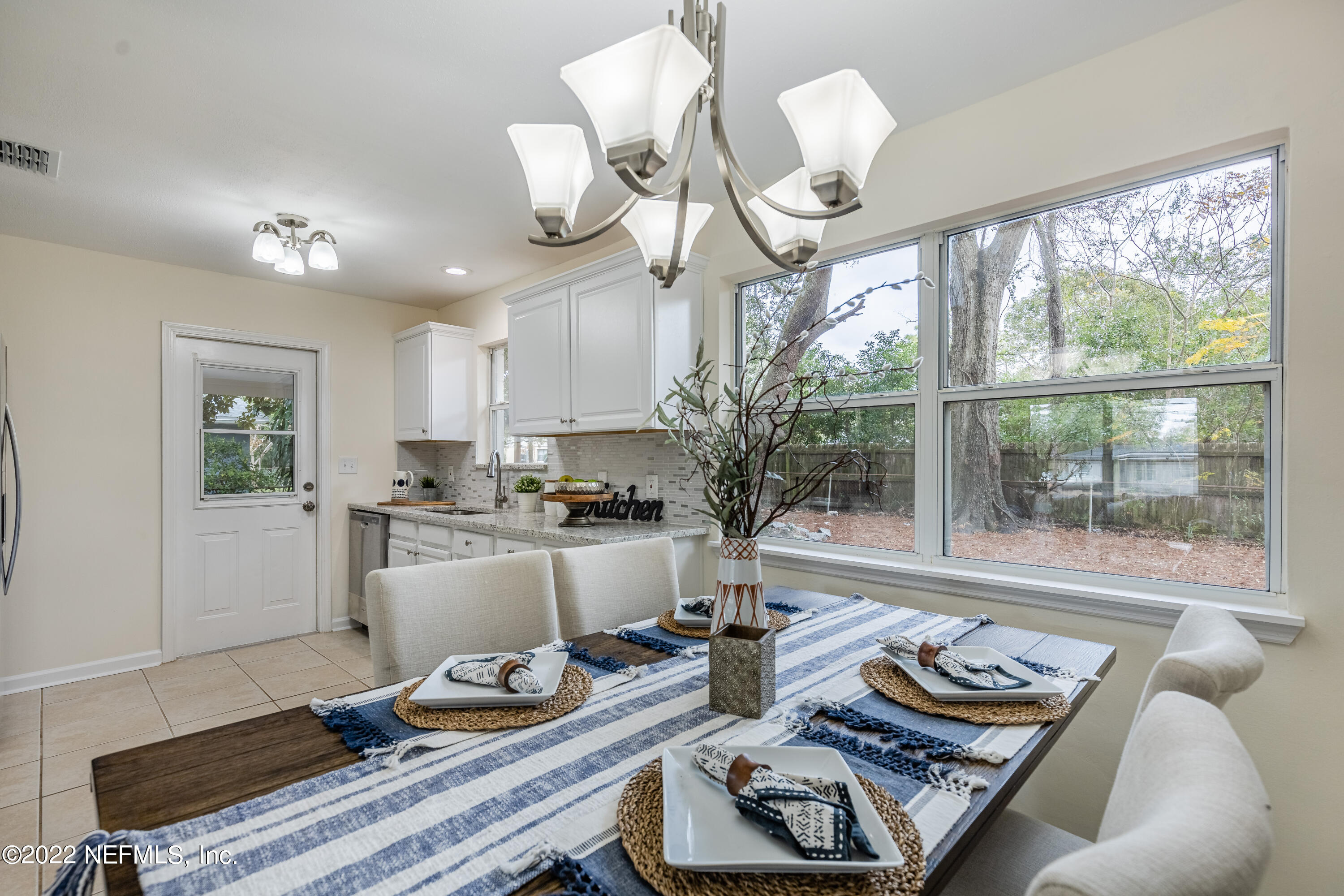 2913 Mansion Road Jacksonville, FL 32277 - Photo 9 of 30 a living room with furniture and a large window