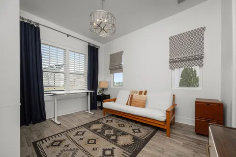 a bedroom with furniture and a window