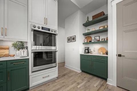 a dining room with furniture window and wooden floor