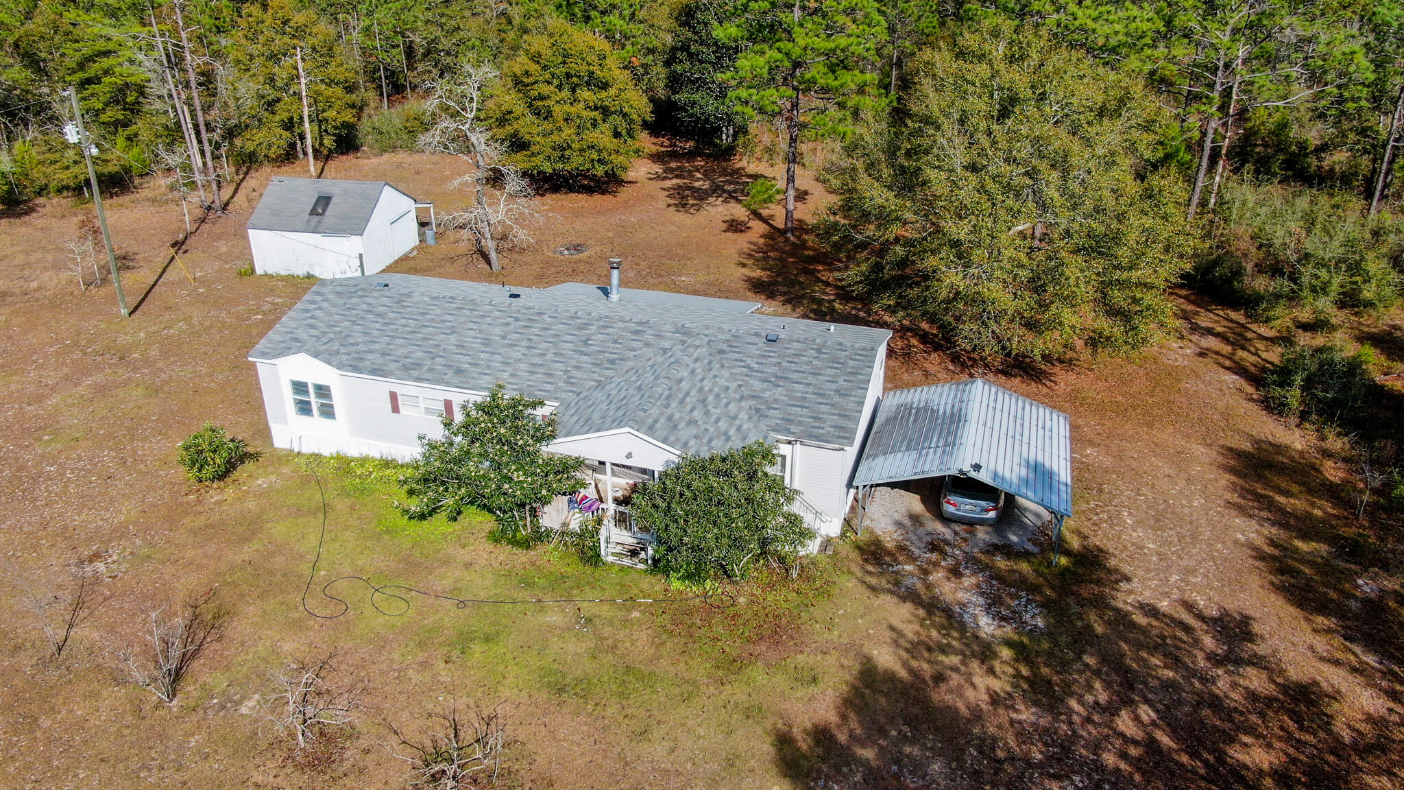 452 Wee Acres Road DeFuniak Springs, FL 32433 - Photo 1 of 23 an aerial view of a house with a yard