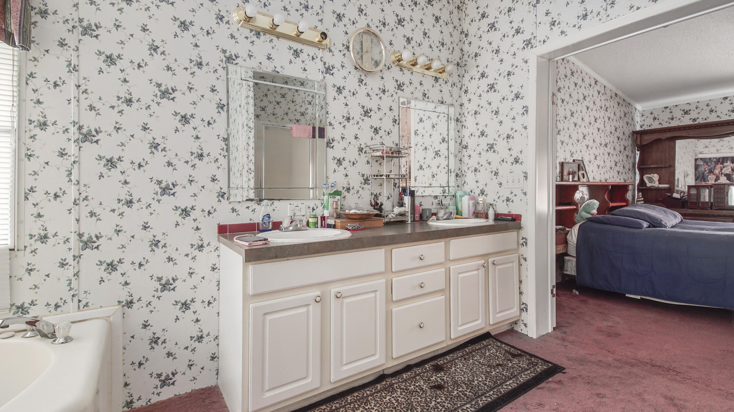452 Wee Acres Road DeFuniak Springs, FL 32433 - Photo 9 of 23 a bathroom with a sink a mirror and a shower