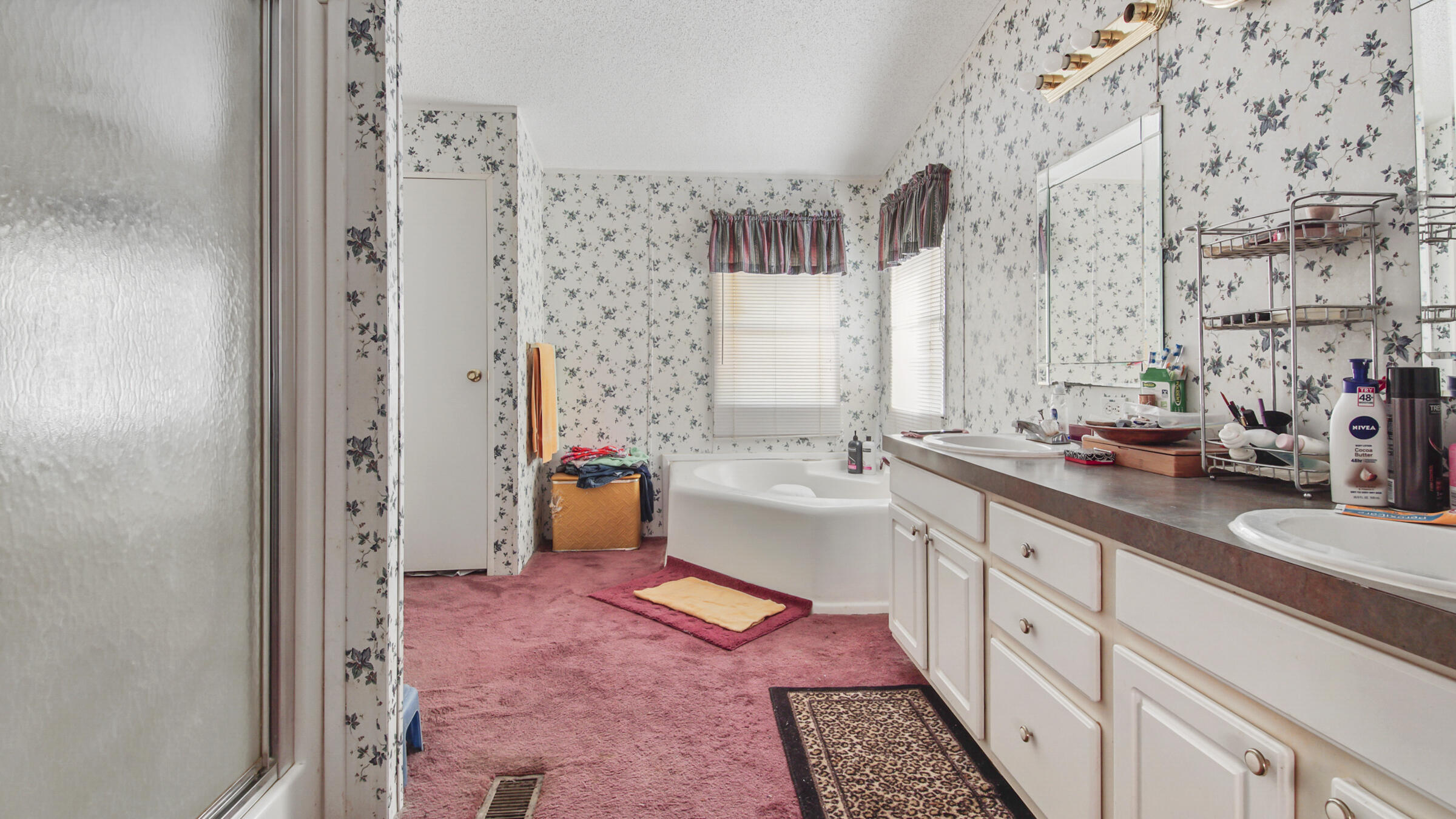 452 Wee Acres Road DeFuniak Springs, FL 32433 - Photo 11 of 23 a large white bathroom with a sink and a large mirror