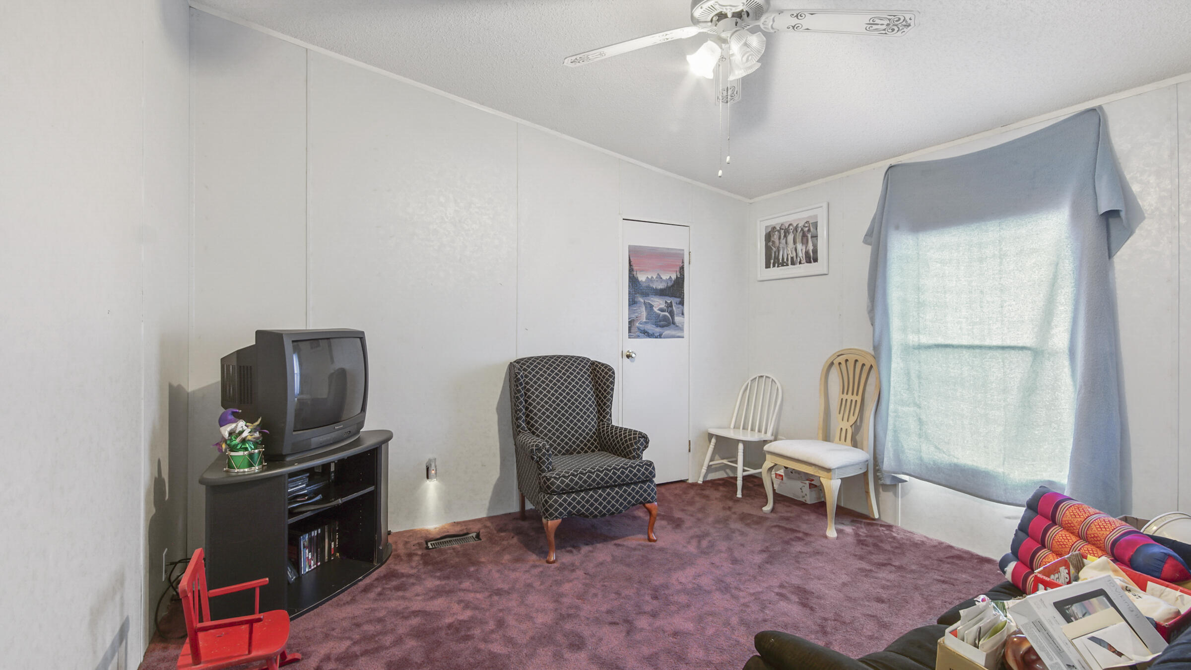 452 Wee Acres Road DeFuniak Springs, FL 32433 - Photo 13 of 23 a living room with furniture and a flat screen tv