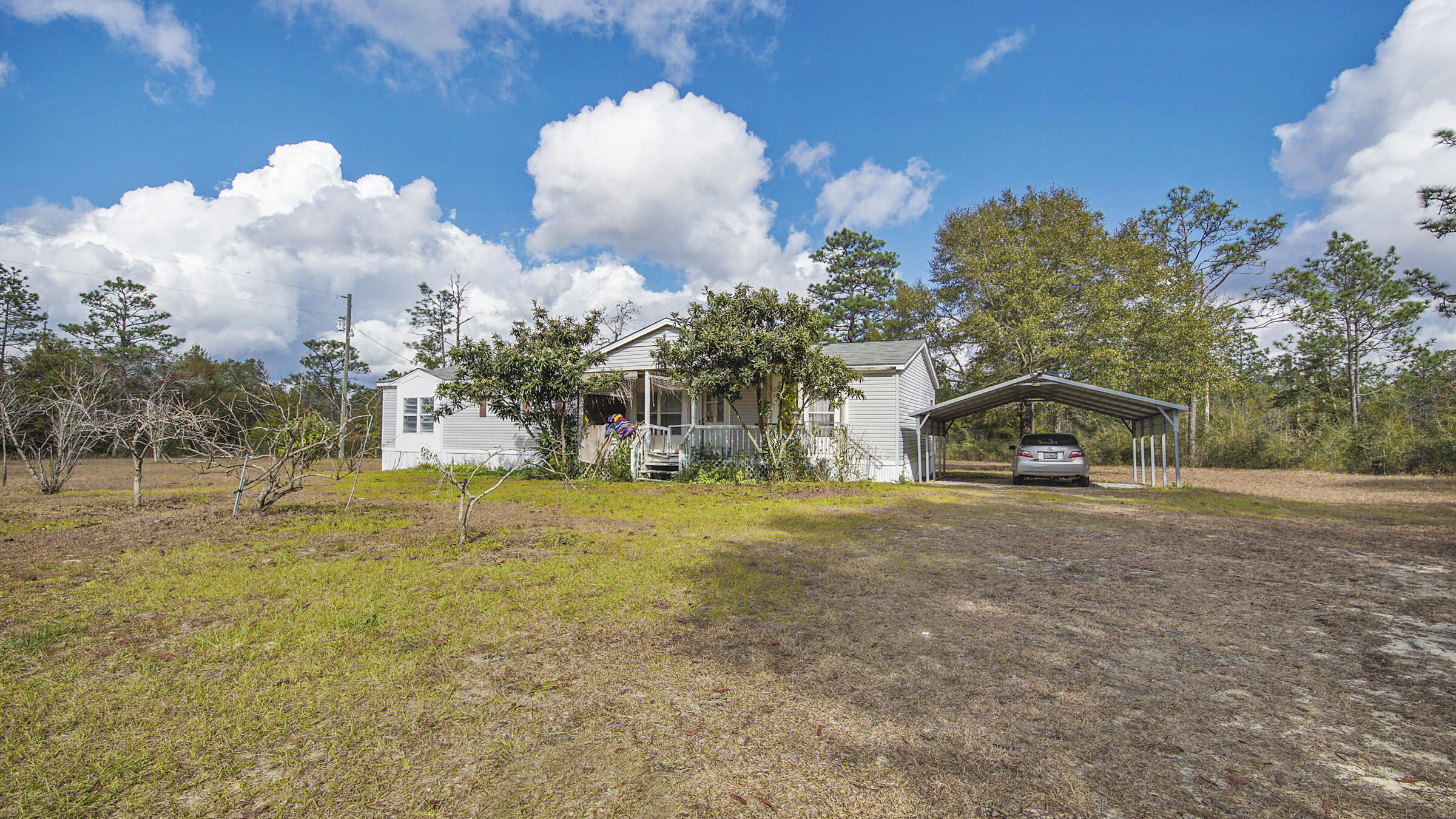 452 Wee Acres Road DeFuniak Springs, FL 32433 - Photo 17 of 23 a view of a house with a yard
