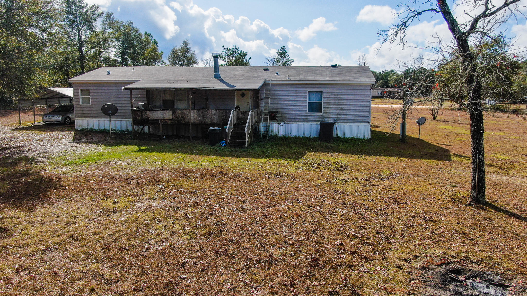 452 Wee Acres Road DeFuniak Springs, FL 32433 - Photo 18 of 23 a front view of a house with a yard