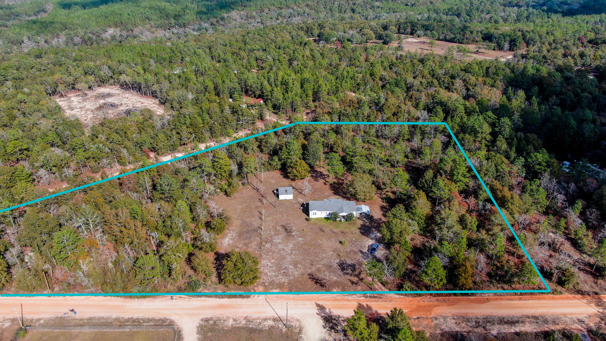 452 Wee Acres Road DeFuniak Springs, FL 32433 - Photo 2 of 23 a view of a yard with a street