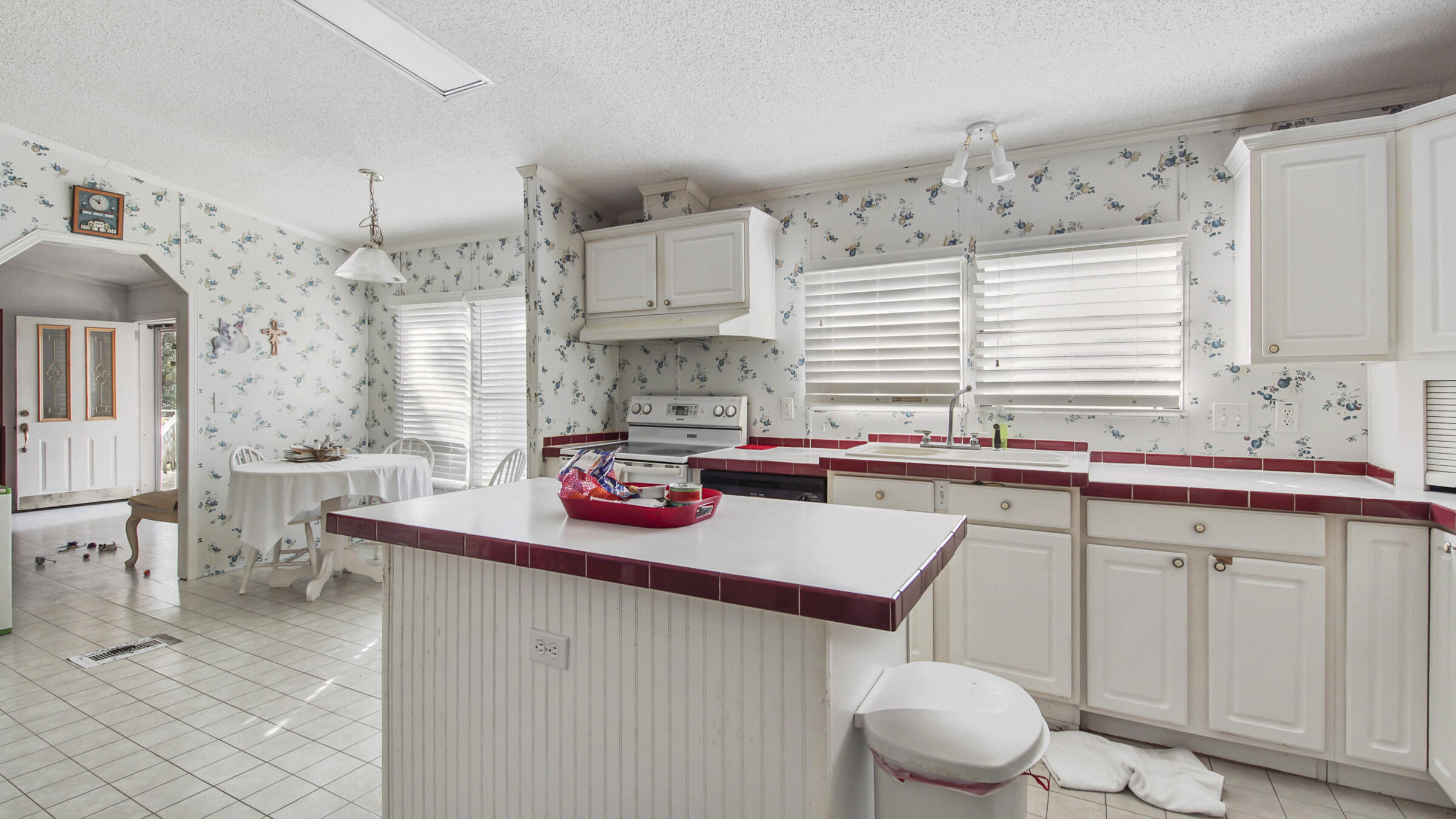 452 Wee Acres Road DeFuniak Springs, FL 32433 - Photo 4 of 23 a kitchen with a sink cabinets and a stove