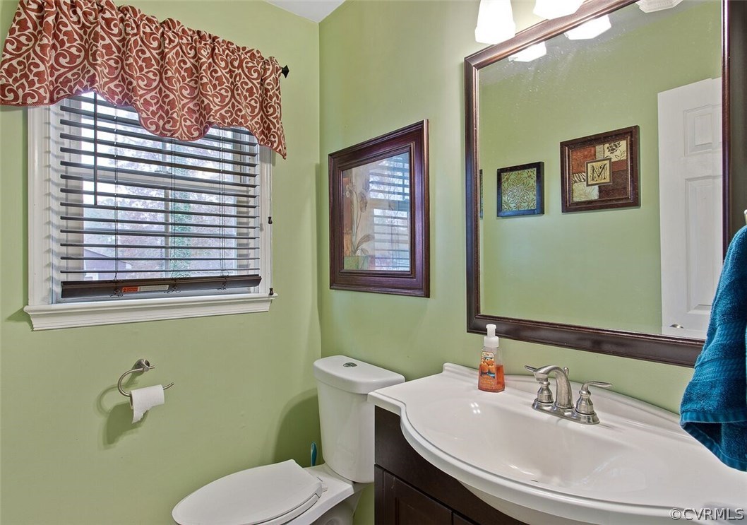 4654 Brookridge Road Chesterfield, VA 23832 - Photo 8 of 29 a bathroom with a toilet sink and mirror