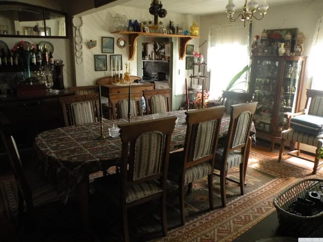 a kitchen with stainless steel appliances a stove a sink and a refrigerator