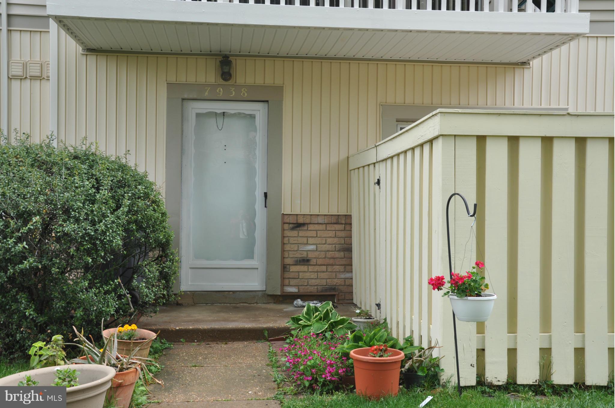7938 Spring Forest Court, Unit 7938 Springfield, VA 22152 - Photo 1 of 29 a front view of a house with fountain