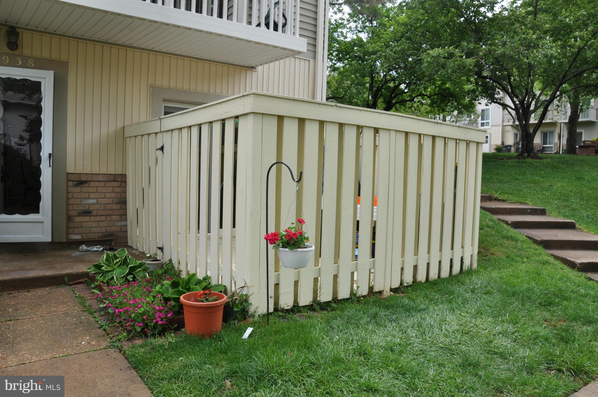 7938 Spring Forest Court, Unit 7938 Springfield, VA 22152 - Photo 2 of 29 a view of a house with backyard and garden