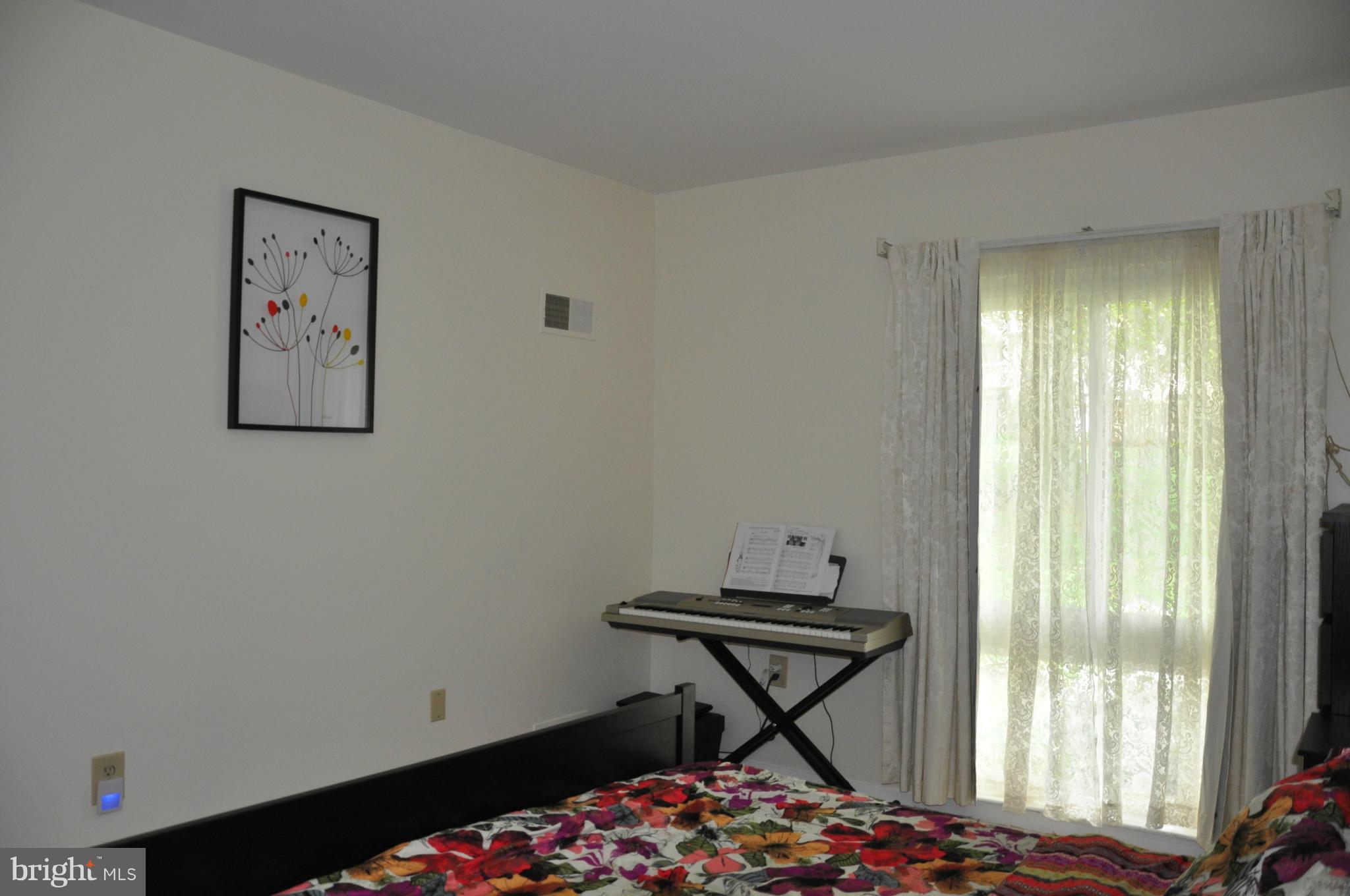 7938 Spring Forest Court, Unit 7938 Springfield, VA 22152 - Photo 17 of 29 a bedroom with a bed and a window