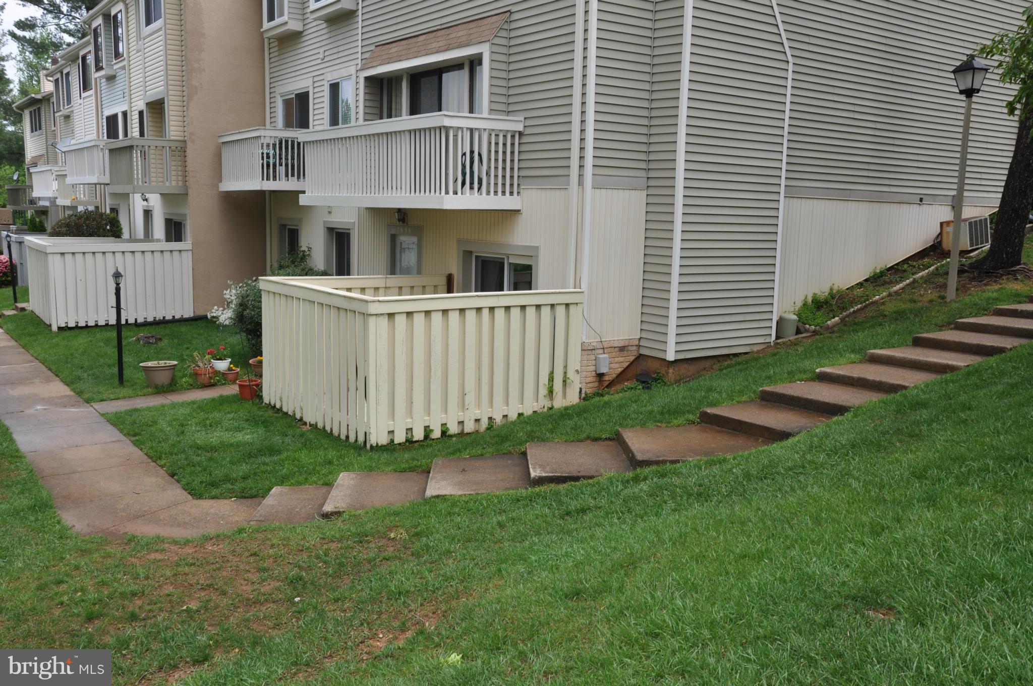 7938 Spring Forest Court, Unit 7938 Springfield, VA 22152 - Photo 3 of 29 a view of backyard of a house