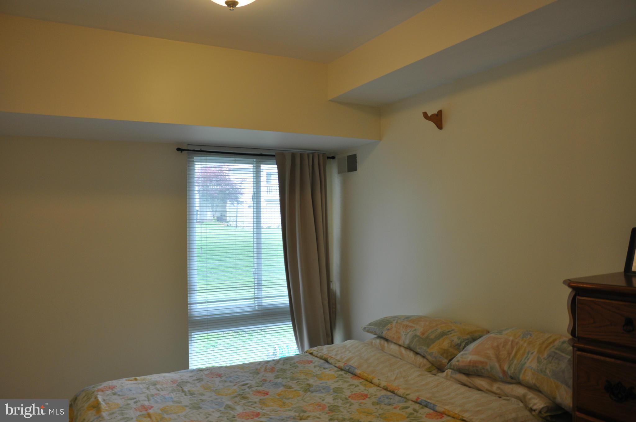 7938 Spring Forest Court, Unit 7938 Springfield, VA 22152 - Photo 22 of 29 a bedroom with a bed and a window