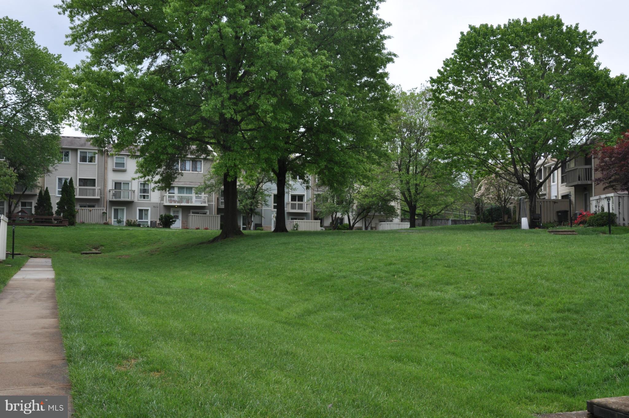 7938 Spring Forest Court, Unit 7938 Springfield, VA 22152 - Photo 27 of 29 a view of a house with backyard