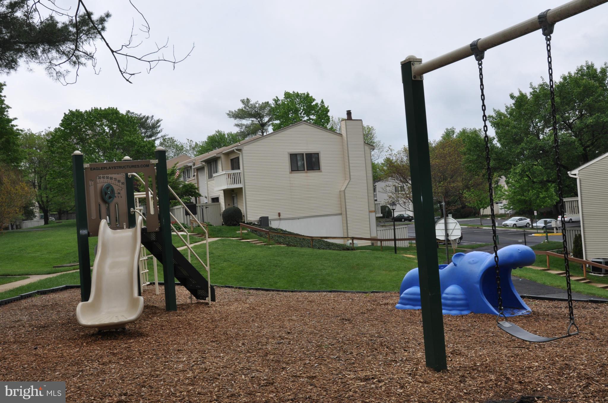 7938 Spring Forest Court, Unit 7938 Springfield, VA 22152 - Photo 28 of 29 a view of a small yard in front of a house
