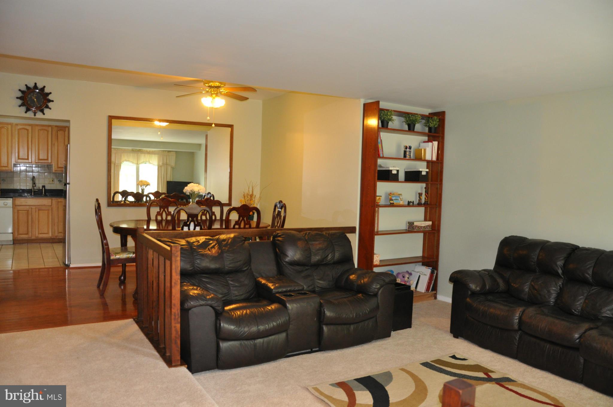 7938 Spring Forest Court, Unit 7938 Springfield, VA 22152 - Photo 4 of 29 a living room with furniture and a couch