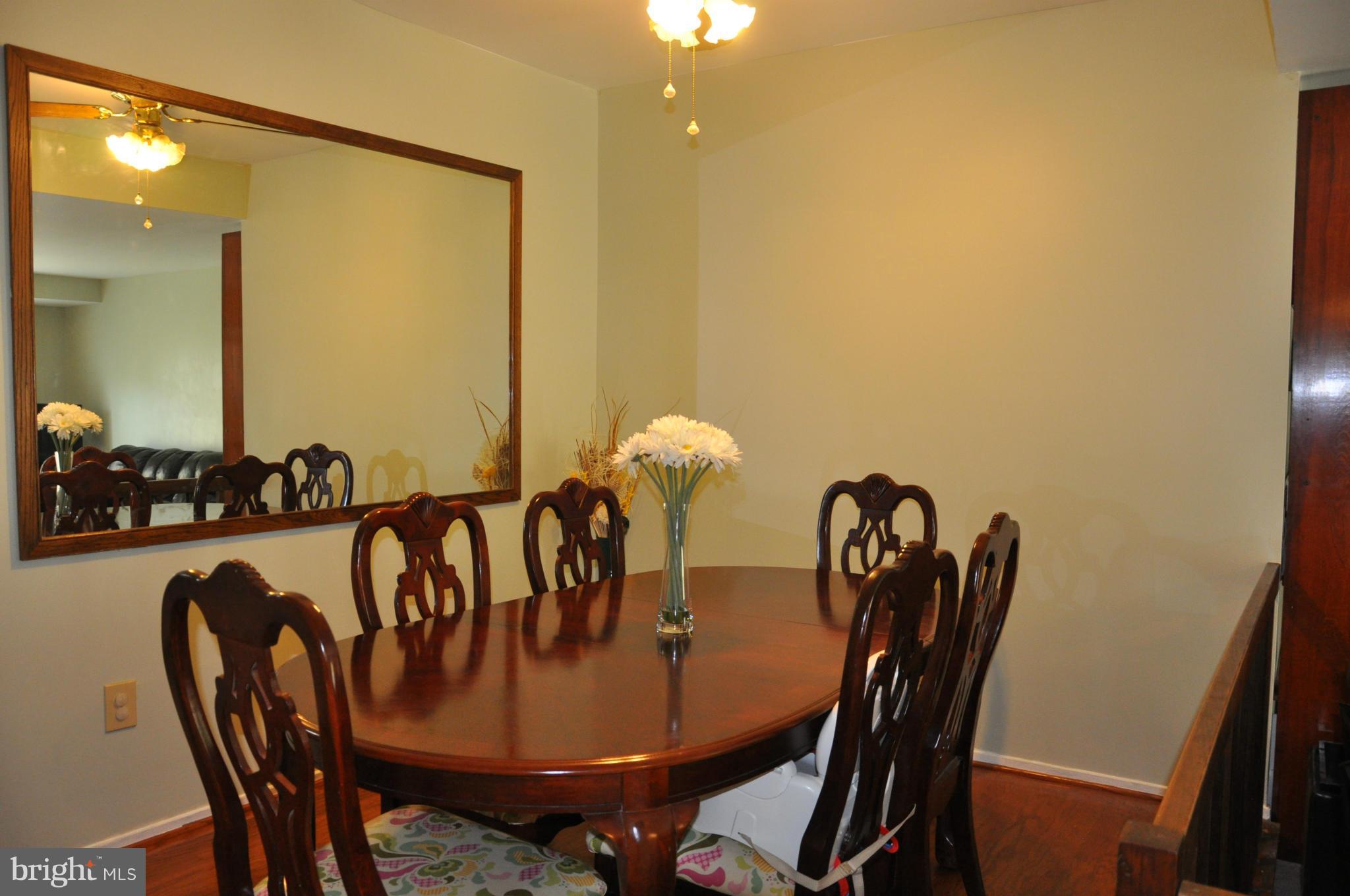 7938 Spring Forest Court, Unit 7938 Springfield, VA 22152 - Photo 8 of 29 a view of a dining room with furniture and window
