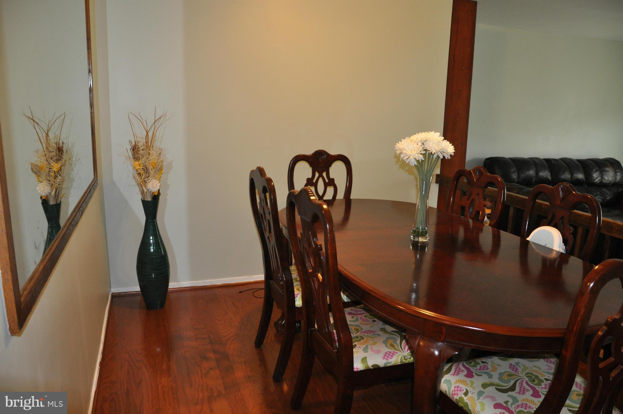 7938 Spring Forest Court, Unit 7938 Springfield, VA 22152 - Photo 10 of 29 a dining room with furniture and wooden floor