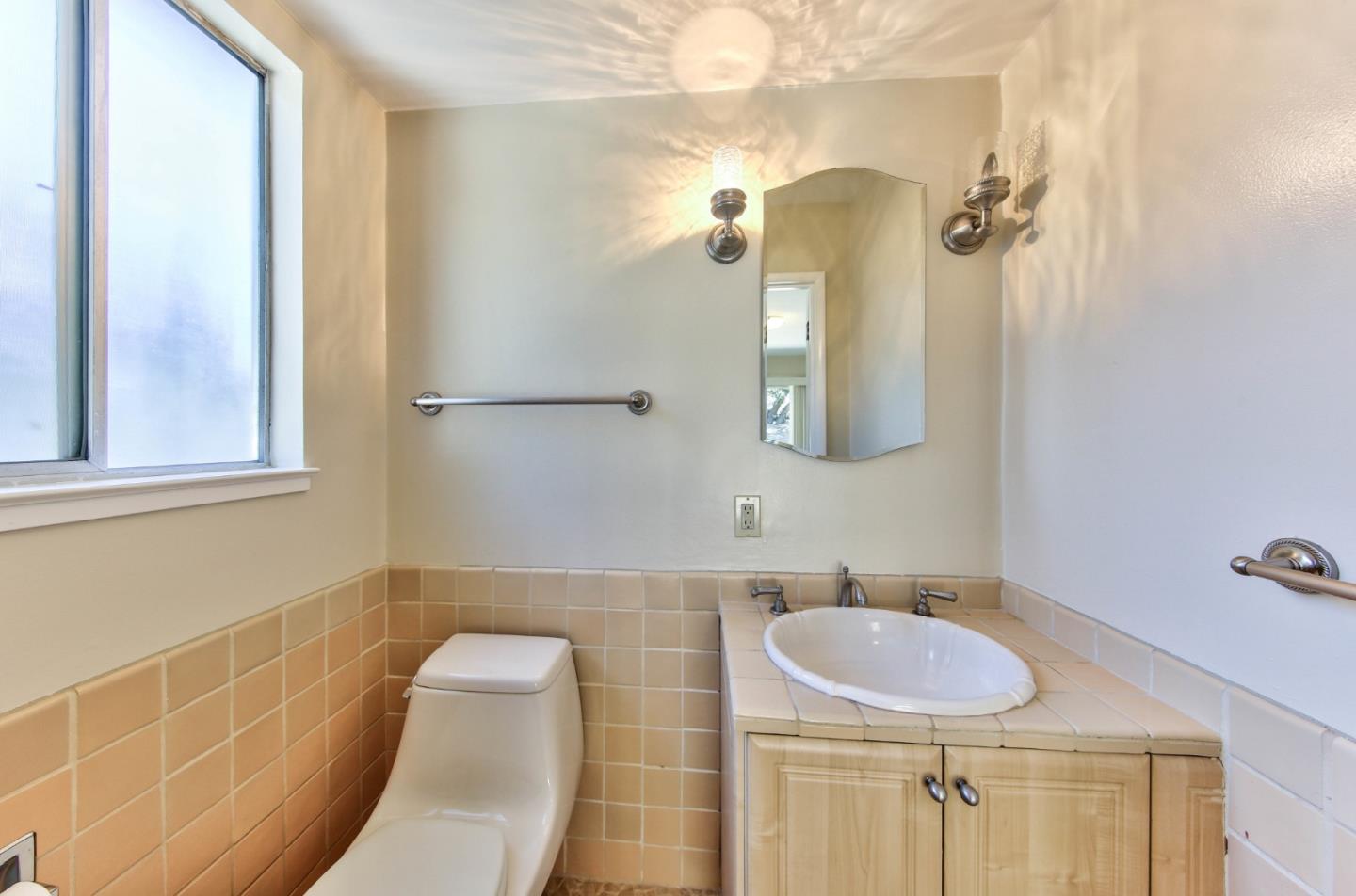 0 Junipero 4 Nw 10th Avenue Carmel, CA 93921 - Photo 12 of 22 a bathroom with a sink and a mirror