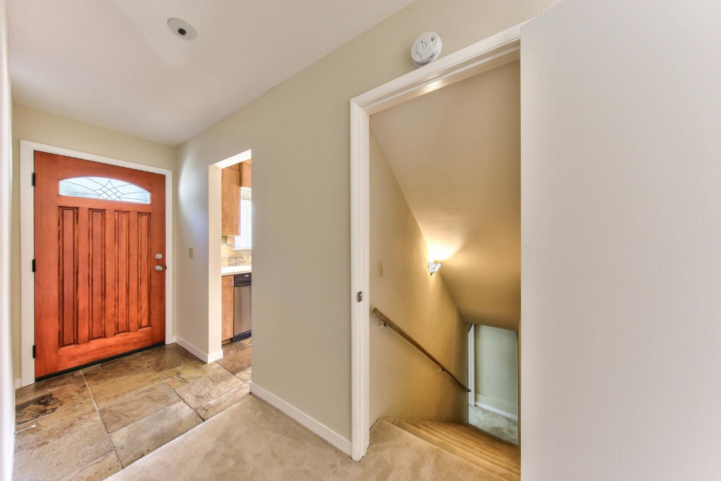 0 Junipero 4 Nw 10th Avenue Carmel, CA 93921 - Photo 18 of 22 a view of a hallway with paintings on the wall