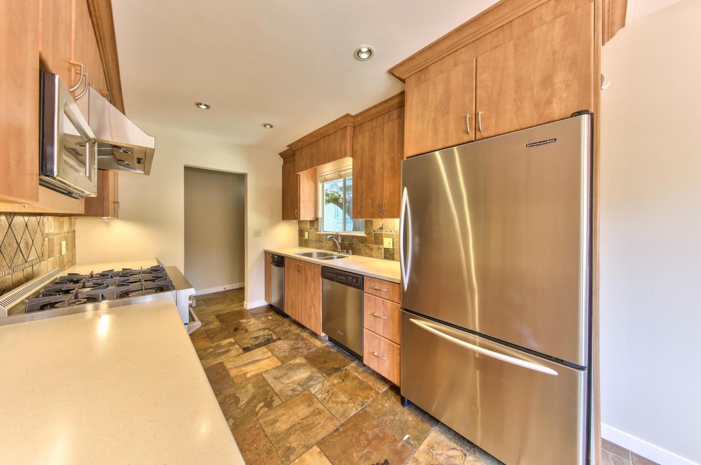 0 Junipero 4 Nw 10th Avenue Carmel, CA 93921 - Photo 8 of 22 a kitchen with stainless steel appliances a refrigerator and a stove