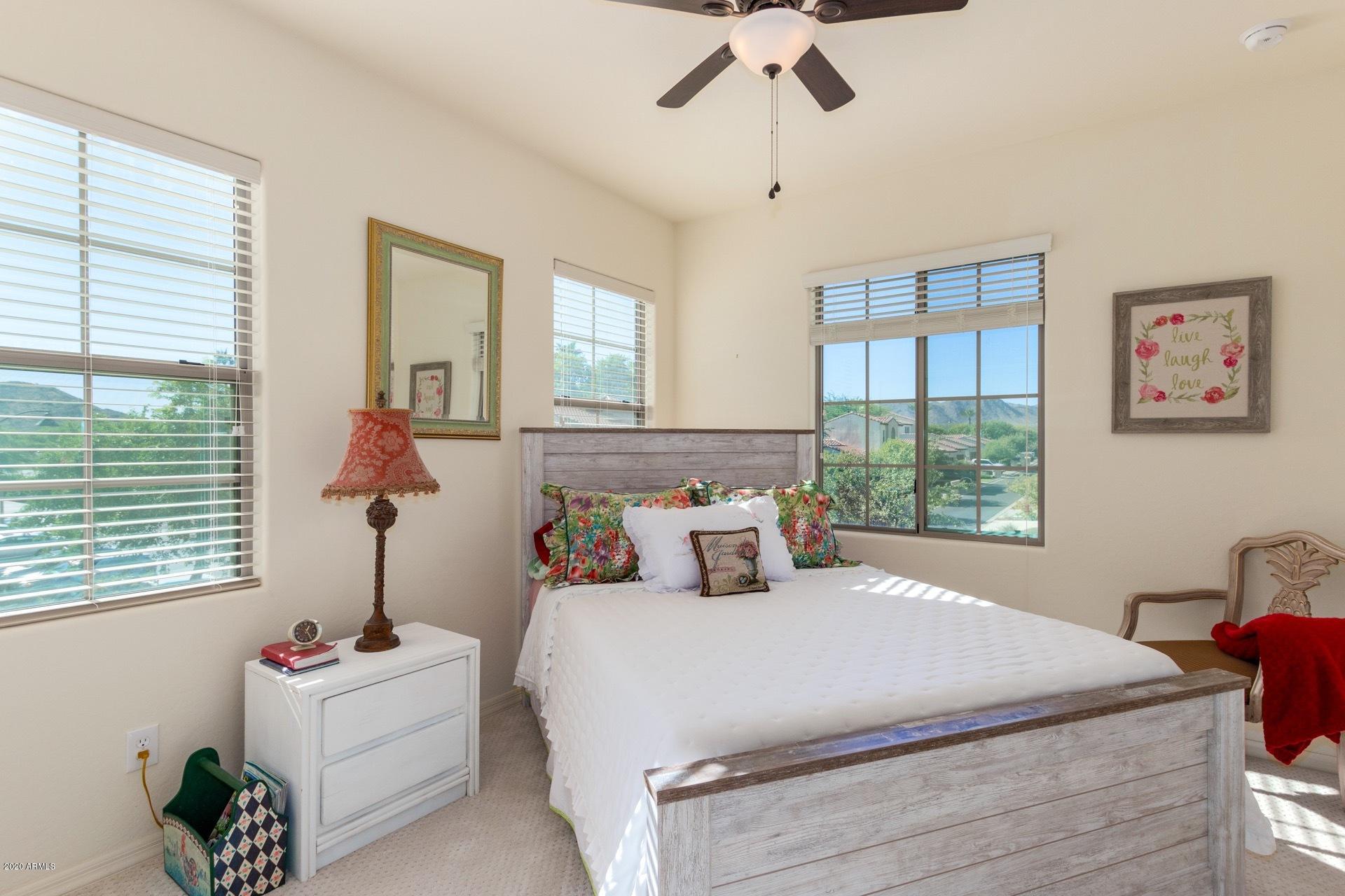 4280 North Verrado Way Buckeye, AZ 85396 - Photo 14 of 41 a bedroom with bed and window