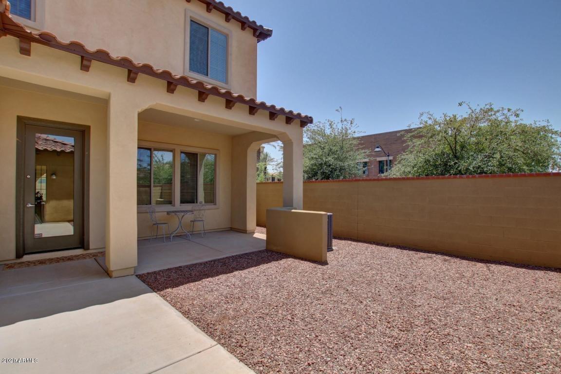 4280 North Verrado Way Buckeye, AZ 85396 - Photo 16 of 41 a view of a building with mountain view and chair